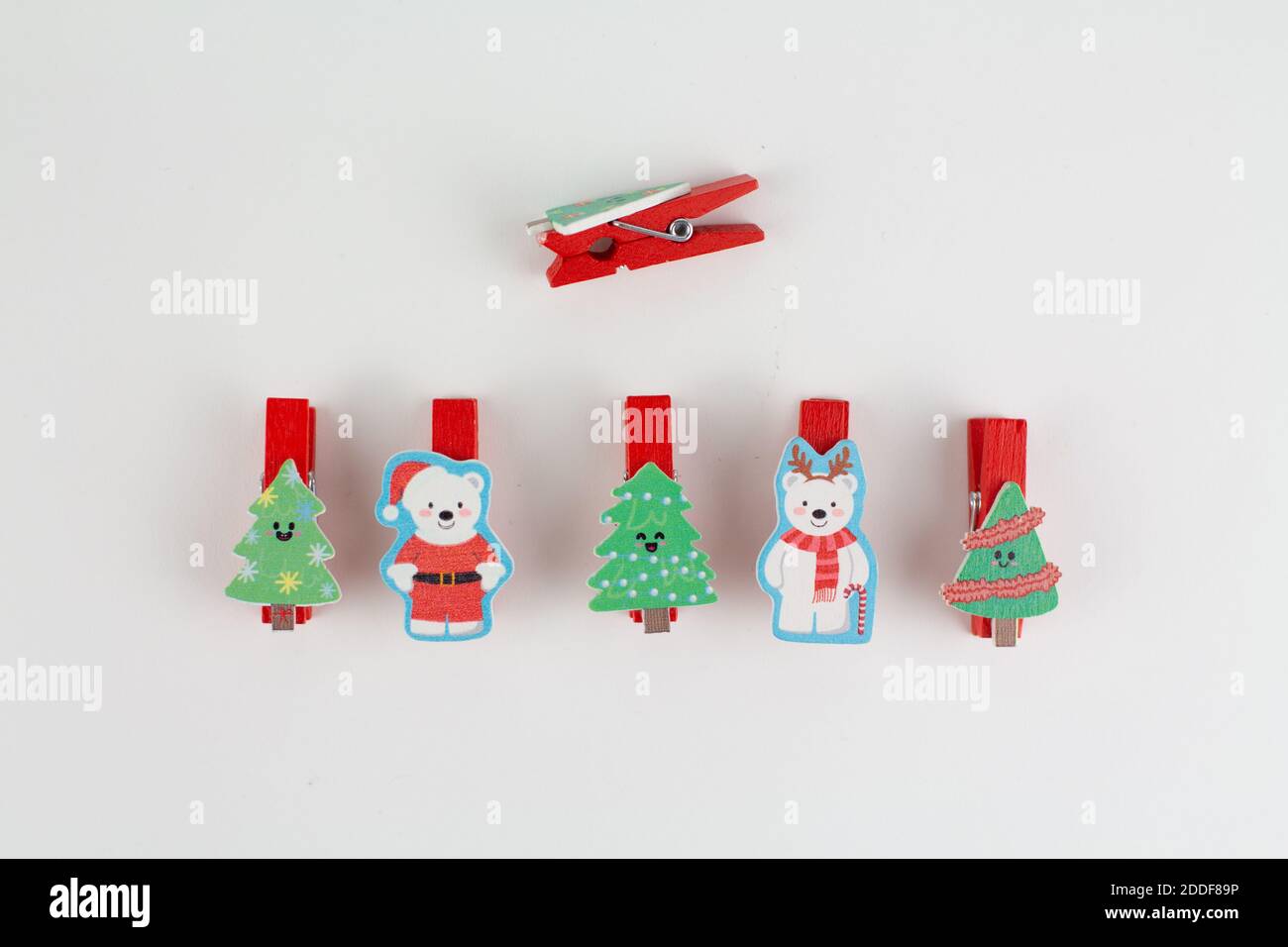 christmas clothespins on white with christmas tree Stock Photo