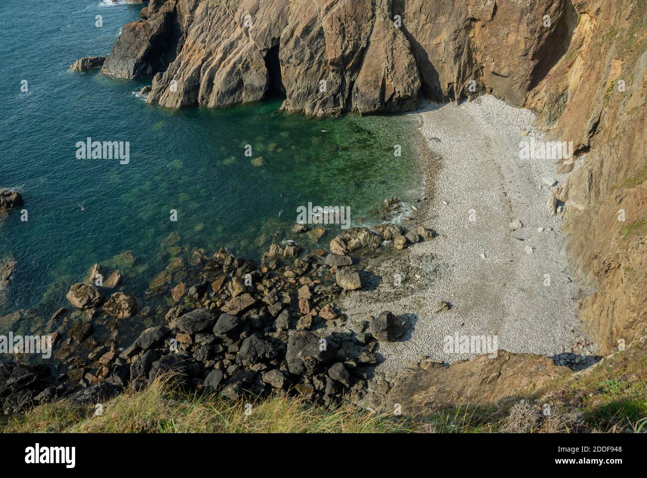 Sheltered cove near Martinshaven with breeding Grey seals, Halichoerus grypus, Pembrokeshire Coast National Park. Wales. Stock Photo