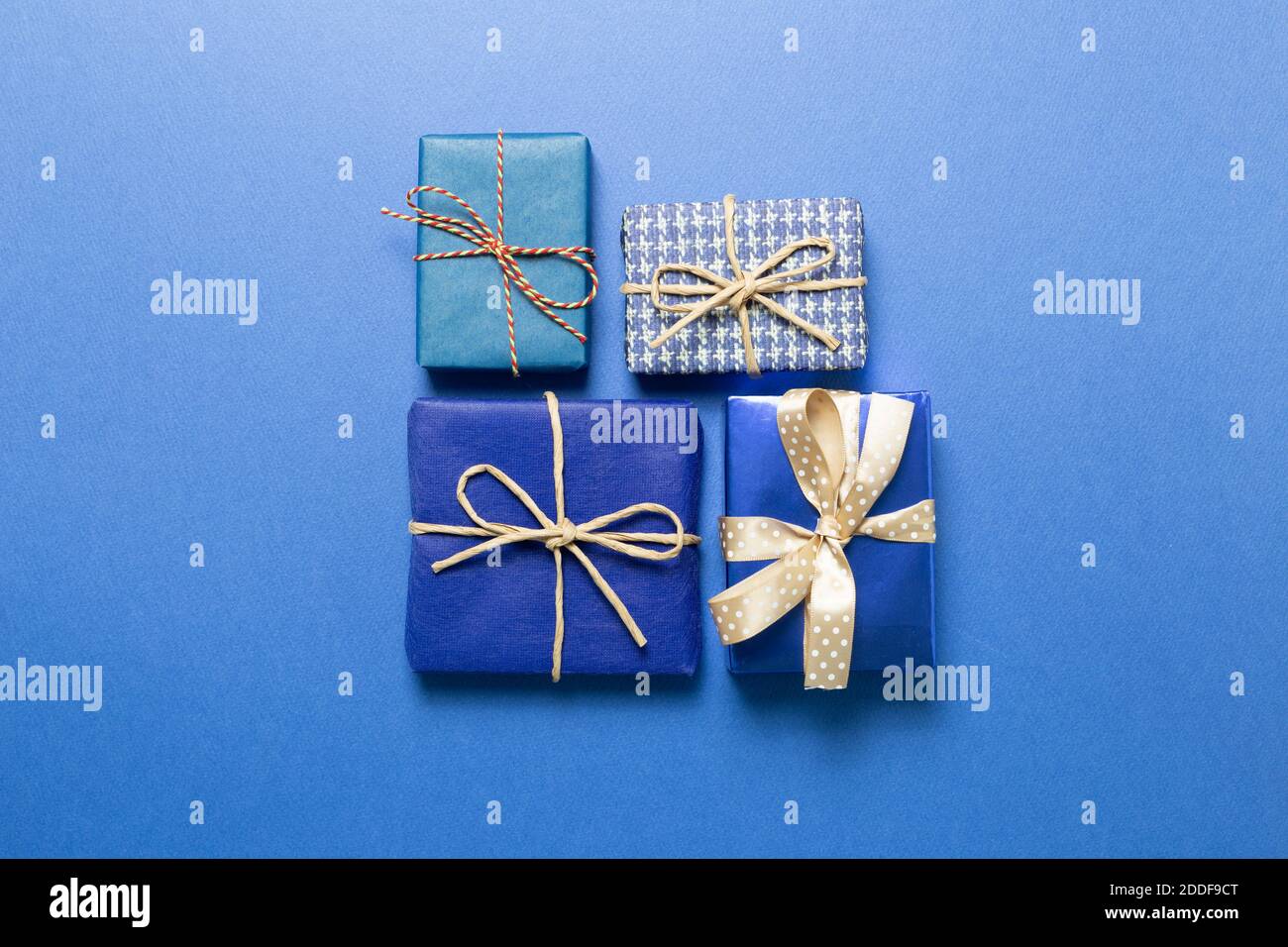 Blue gift boxes on blue background. top view Stock Photo