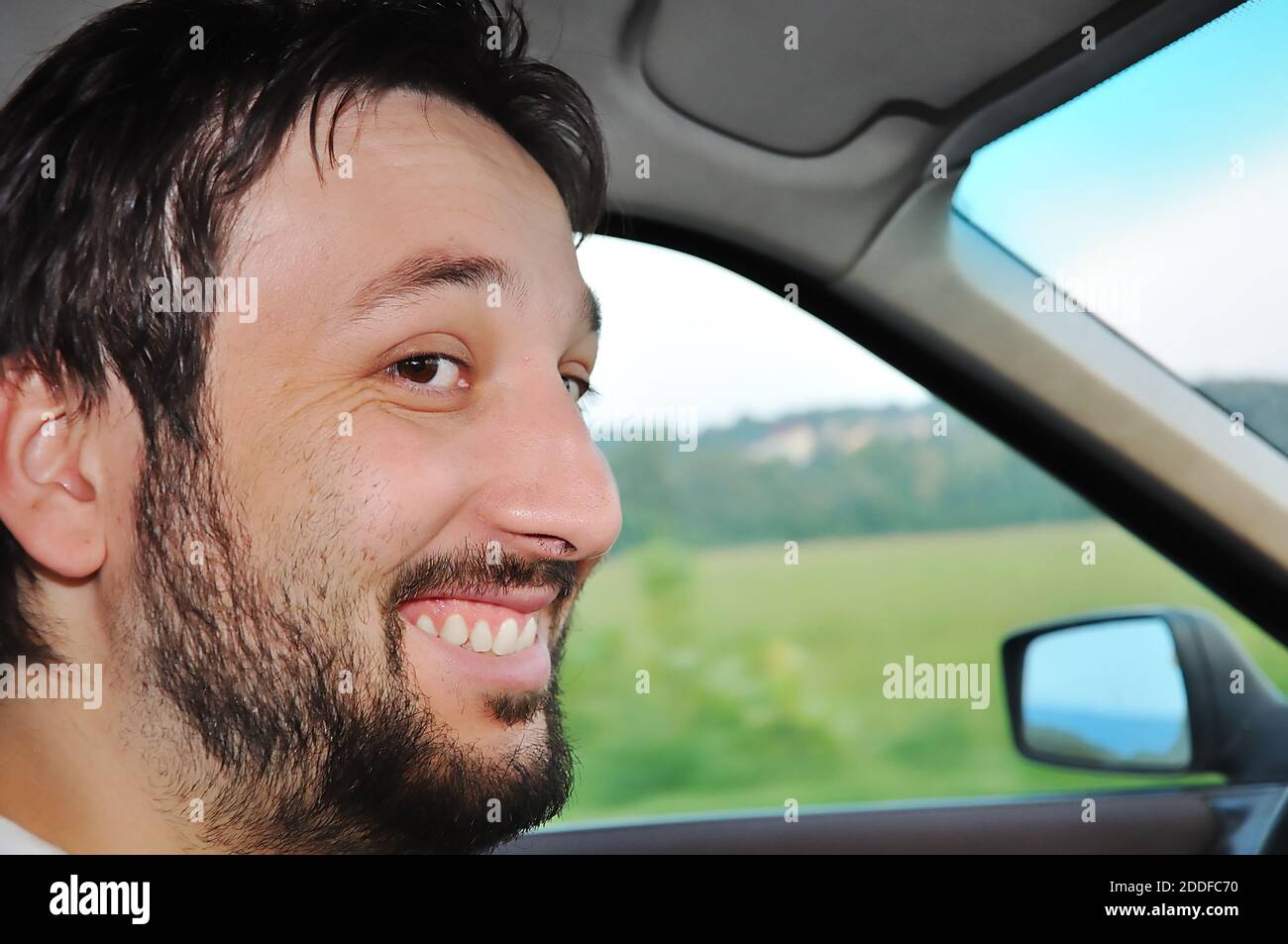 Happy man beard driving car hi-res stock photography and images - Alamy