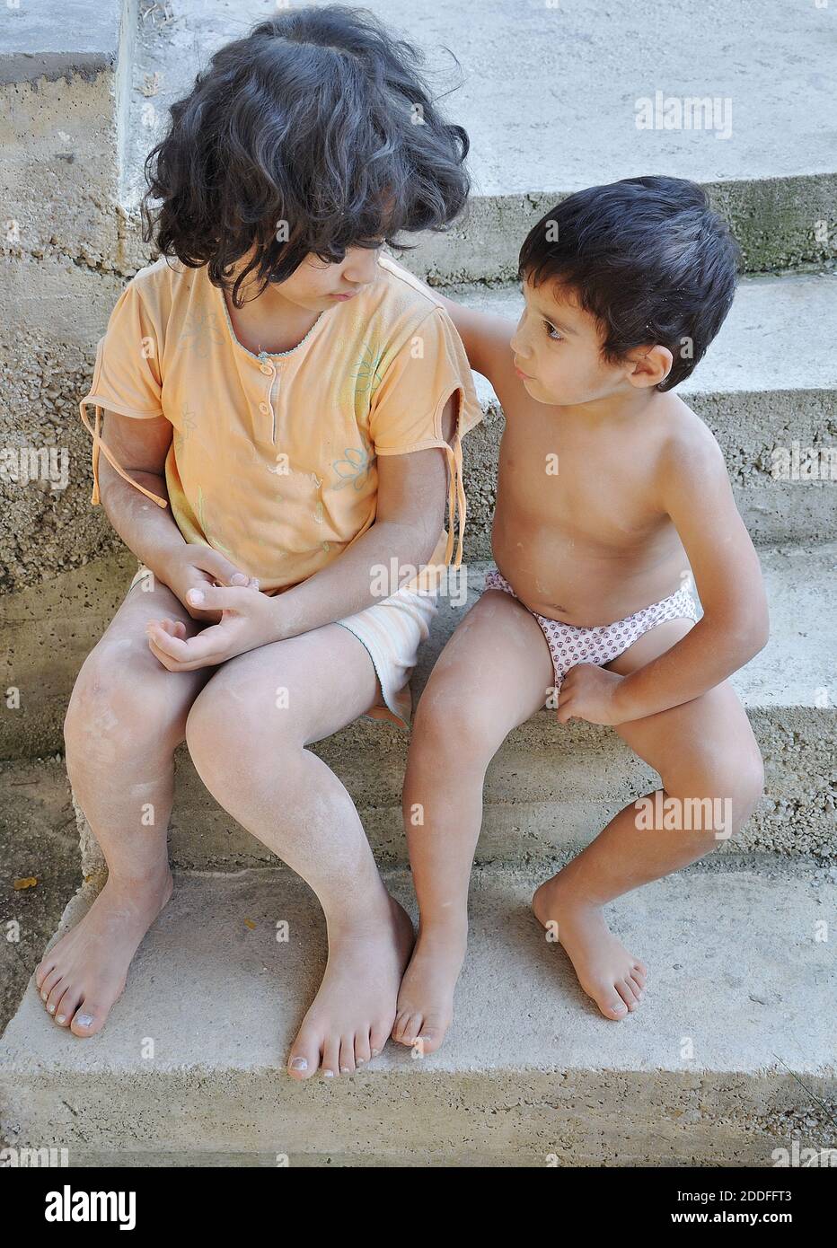 Poverty and poorness on the expression of children Stock Photo
