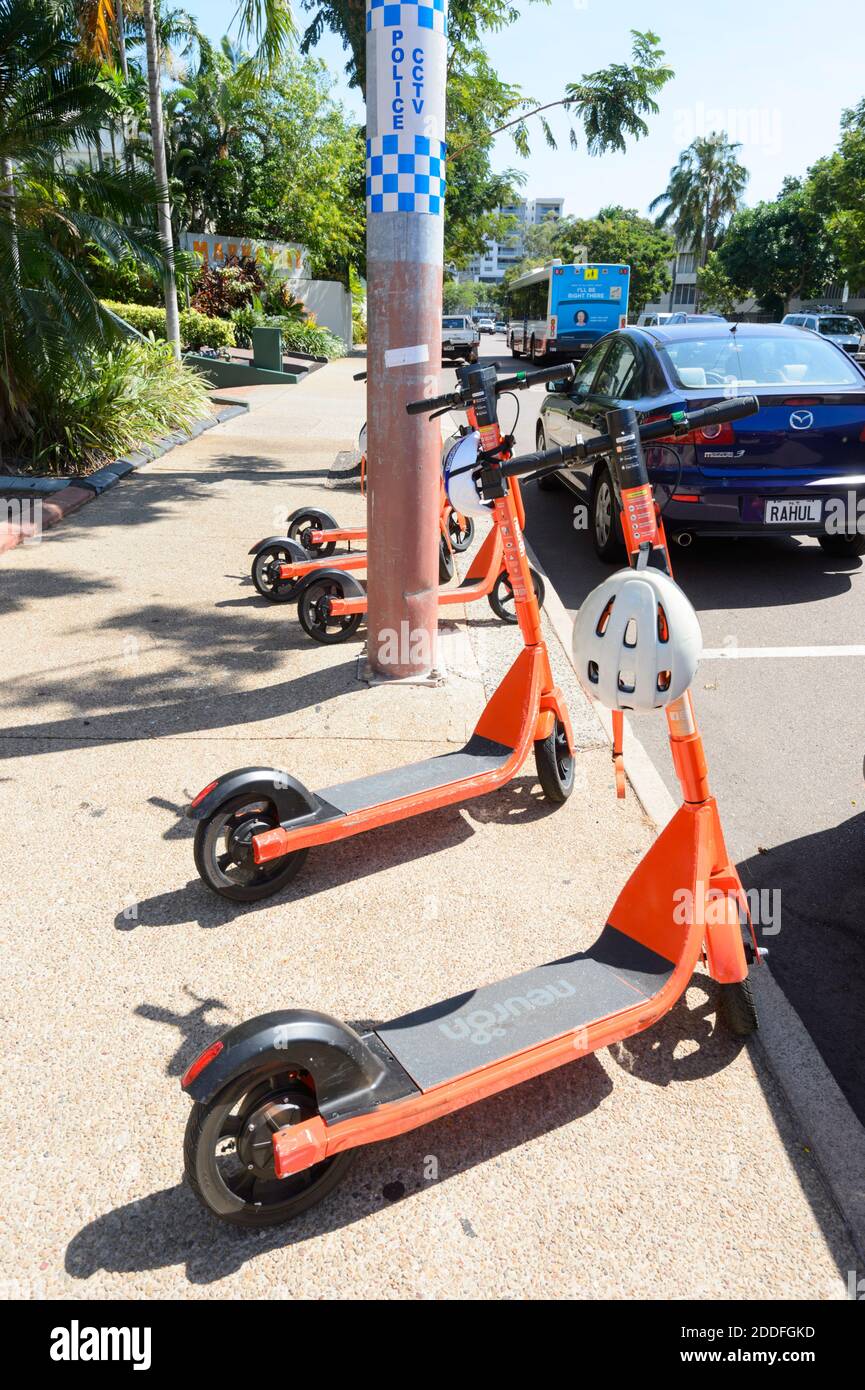 Neuron electric scooters or e-scooters lined up in the street, Darwin, Northern Territory, NT, Australia Stock Photo