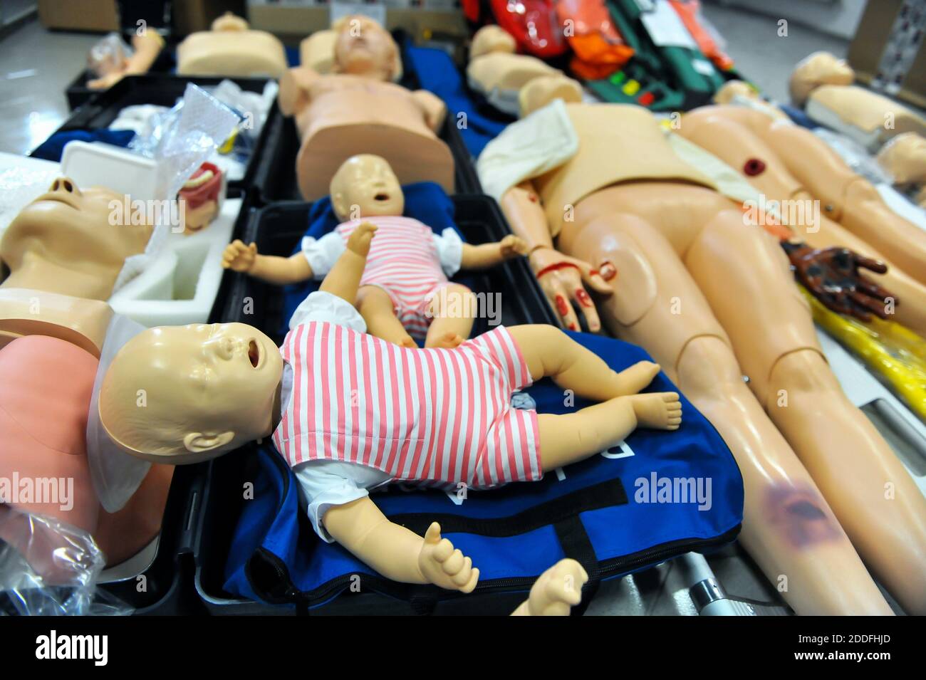 Shallow depth of field (selective focus) image with plastic dummies (babies and adults) used for CPR training. Stock Photo