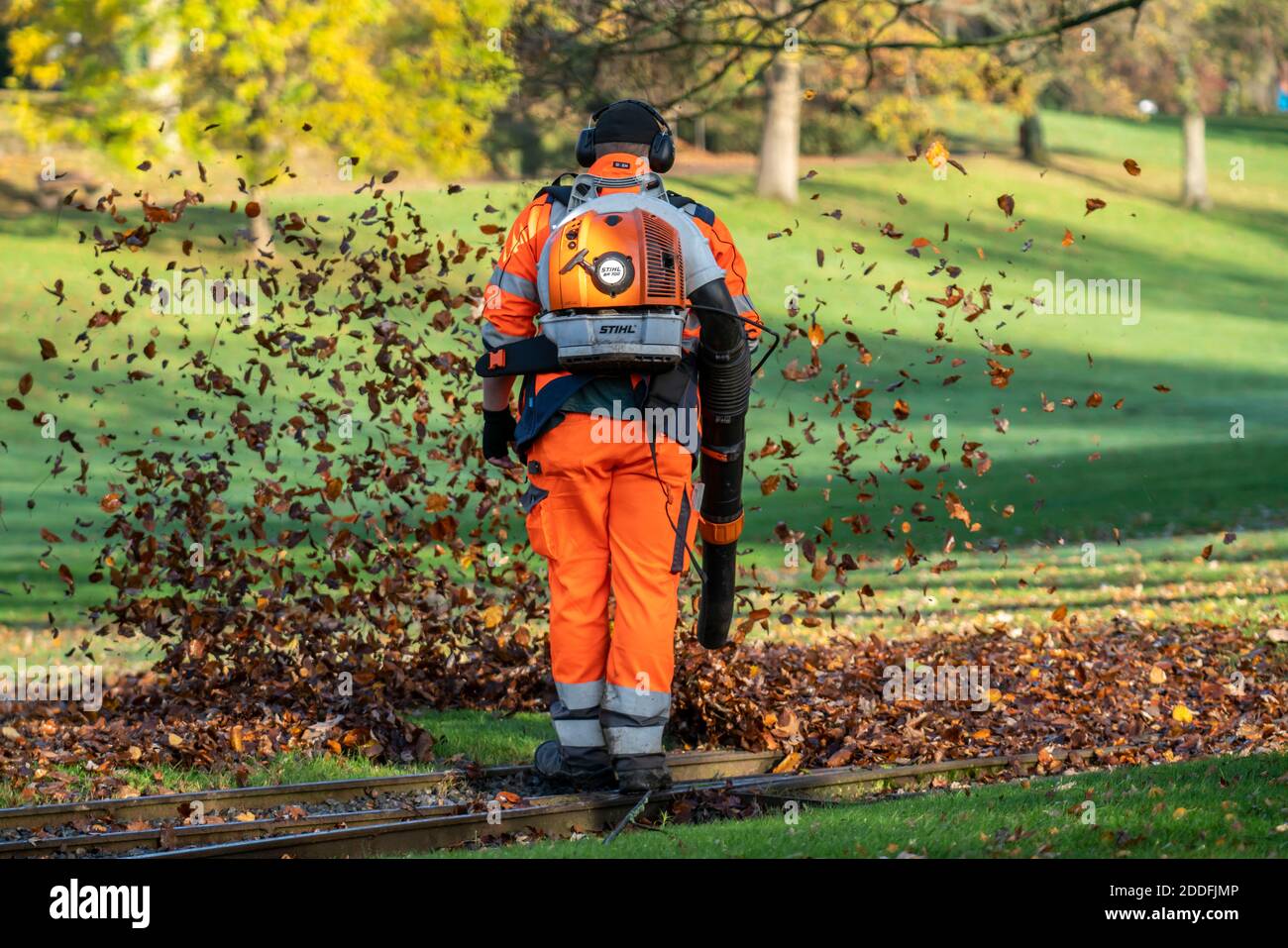 Leaf blower, removal of autumn leaves in a city park Stock Photo Alamy