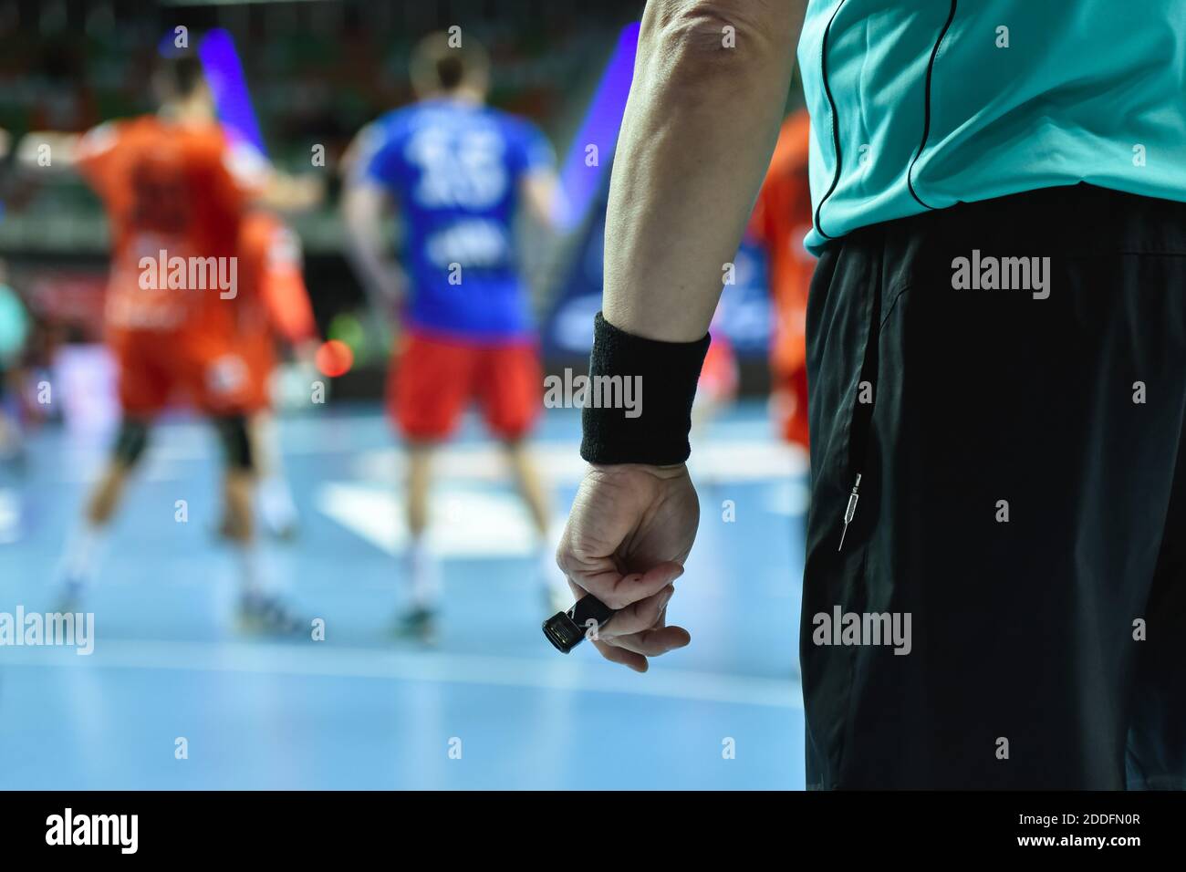 Handball referee hand with whistle Stock Photo Alamy