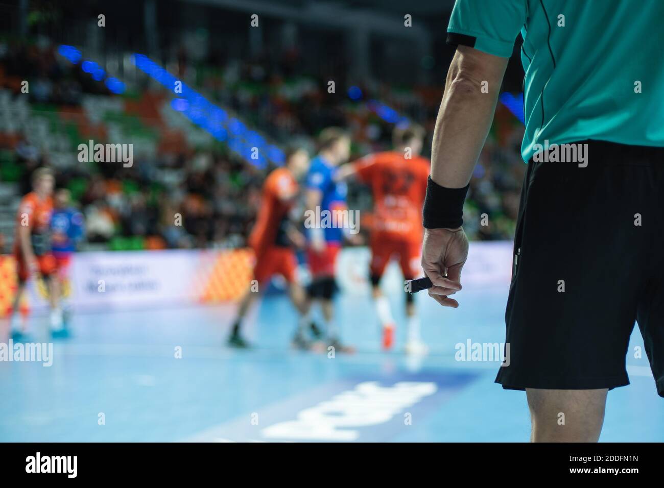 Handball referee hand with whistle Stock Photo Alamy