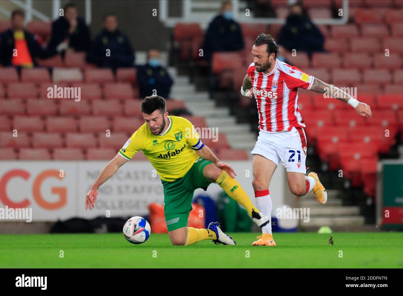 Steven Fletcher #21 of Stoke City and Grant Hanley #5 of Norwich City challenge for the ball Stock Photo