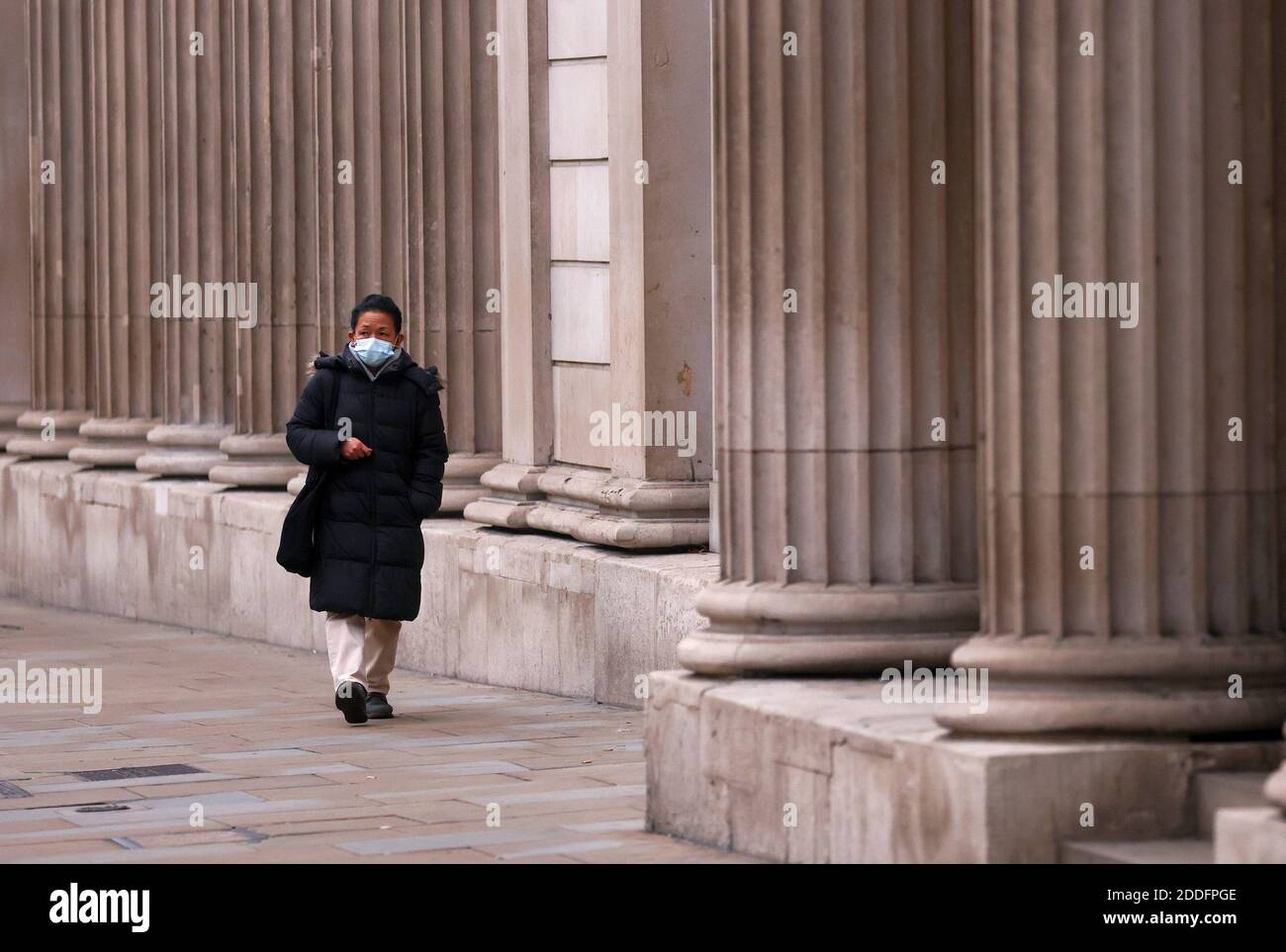 A pedestrian walks past the Bank of England, in London, Britain November 25, 2020. REUTERS/Simon Dawson Stock Photo