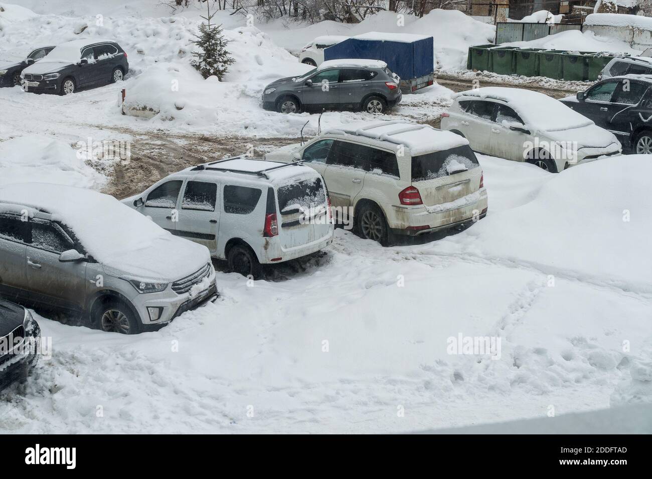 Cars covered with snow in the Parking lot Stock Photo - Alamy