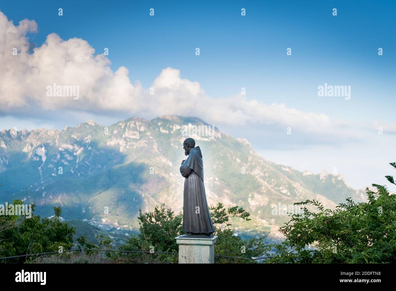 The view across the valley taken from the beautiful town of Ravello on the Amalfi Coast, Italy. The Paolino Vassallo Memorial statue looks on. Stock Photo