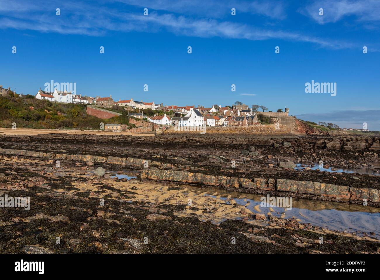 This photo not only shows the beautiful location of Crail in Fife's East Neuk, but how rocky the coastline is here. There are countless rock pools too Stock Photo