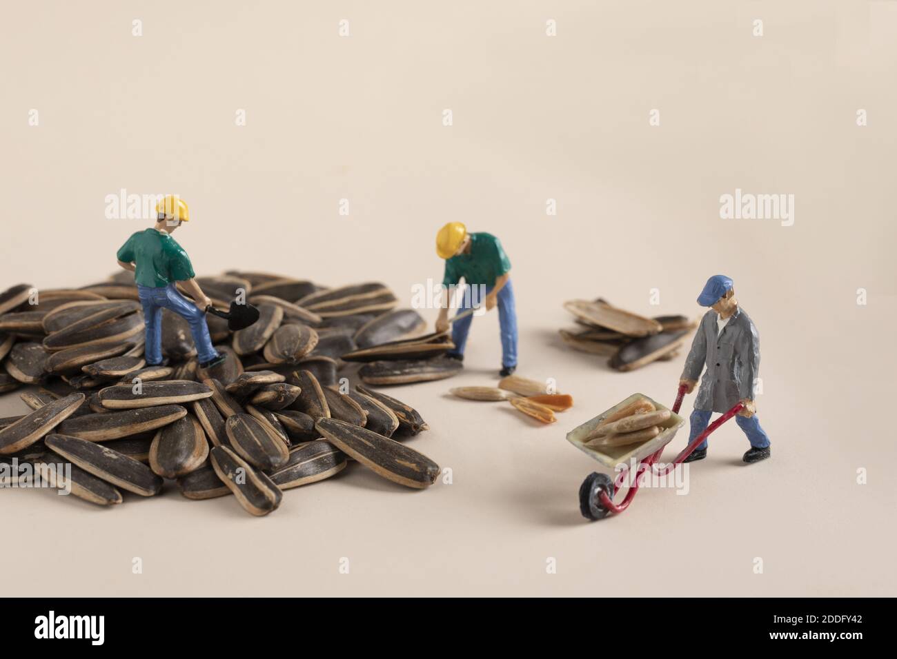 A closeup shot of mini construction worker figurines working on
