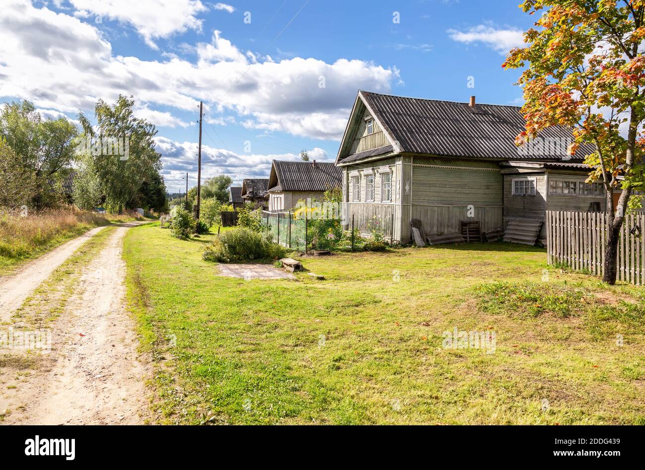 Traditional old rural wooden houses in russian village in summer sunny ...