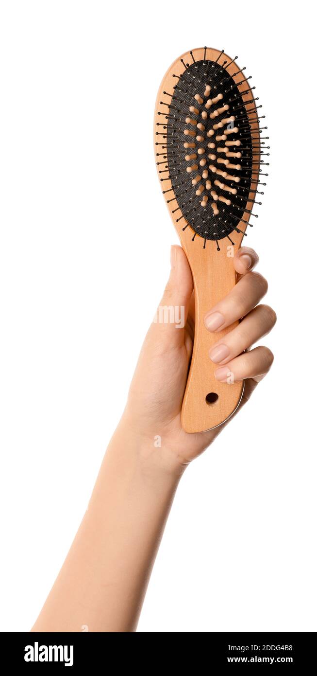 Woman hand and hair brush on white background Stock Photo Alamy