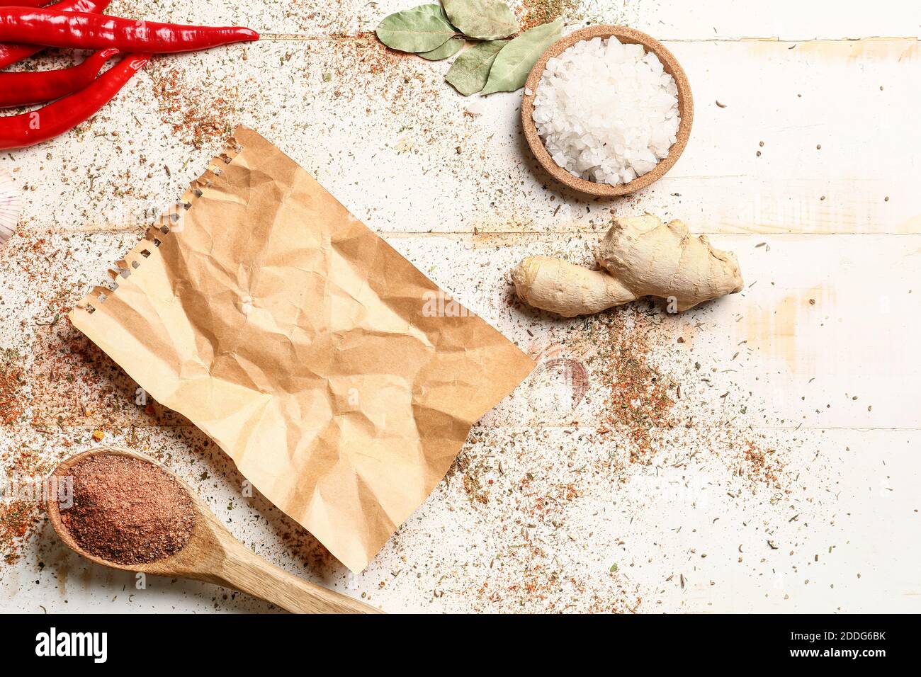 Old paper for recipes  with scattered spices on light background Stock Photo