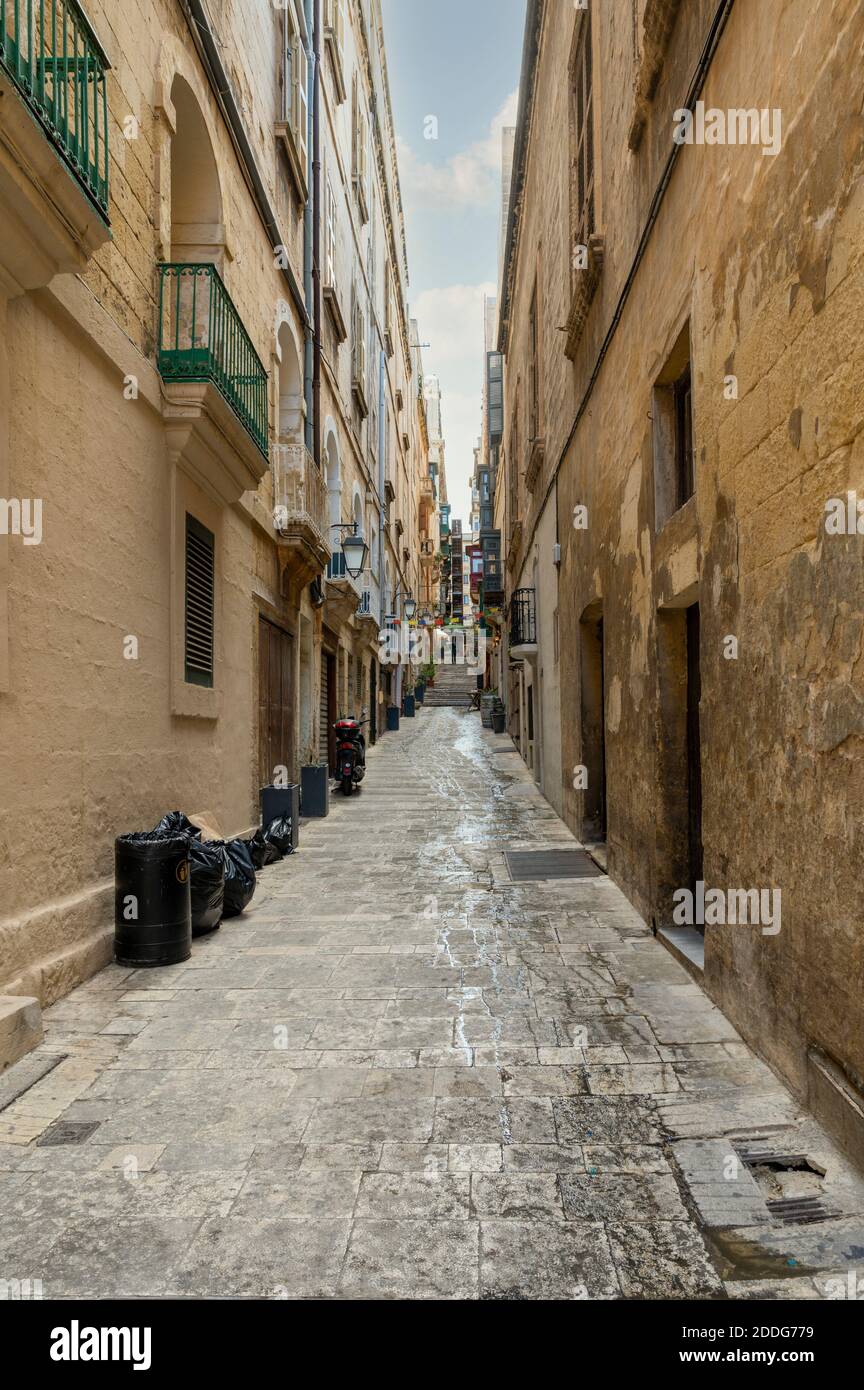 Narrow street leading to some steps in Valletta the capital city of Malta. Stock Photo