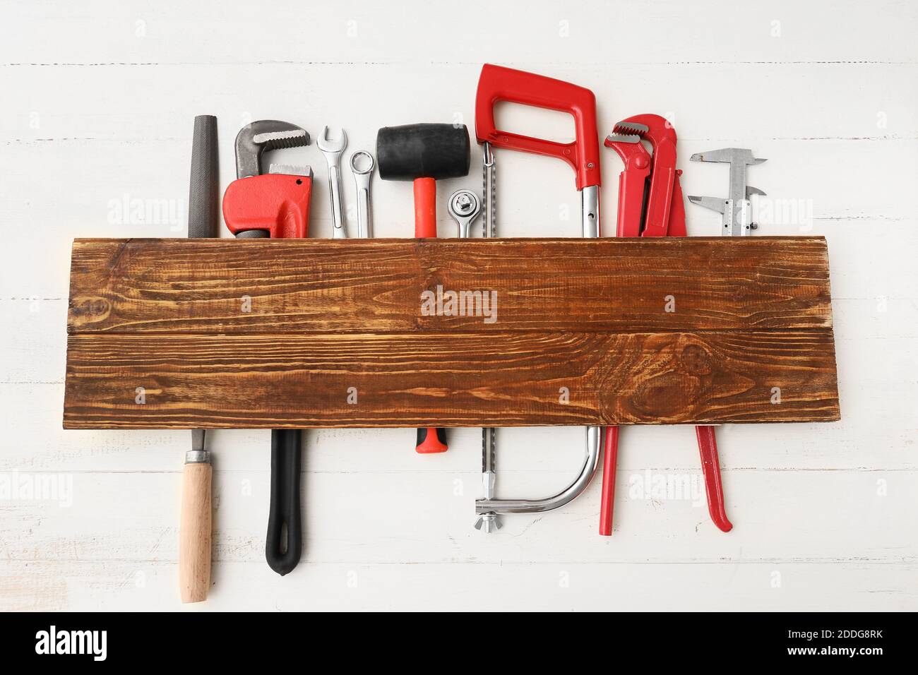 Set of construction tools on white wooden background Stock Photo - Alamy