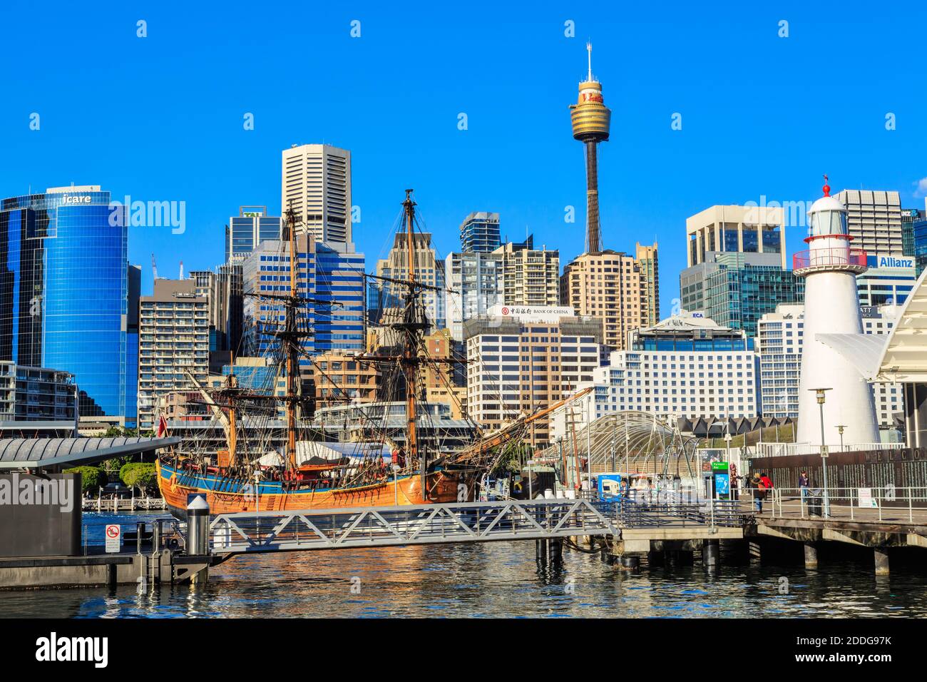 Darling Harbour, Sydney, Australia. In the foreground is a replica of Captain Cook's ship HMS 'Endeavour', with the city skyline behind Stock Photo