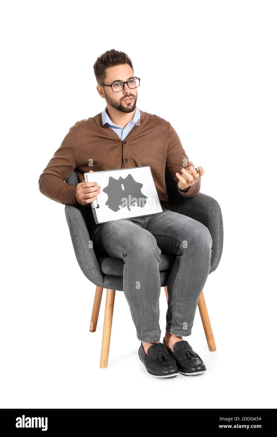 Male psychologist sitting in armchair on white background Stock Photo Alamy