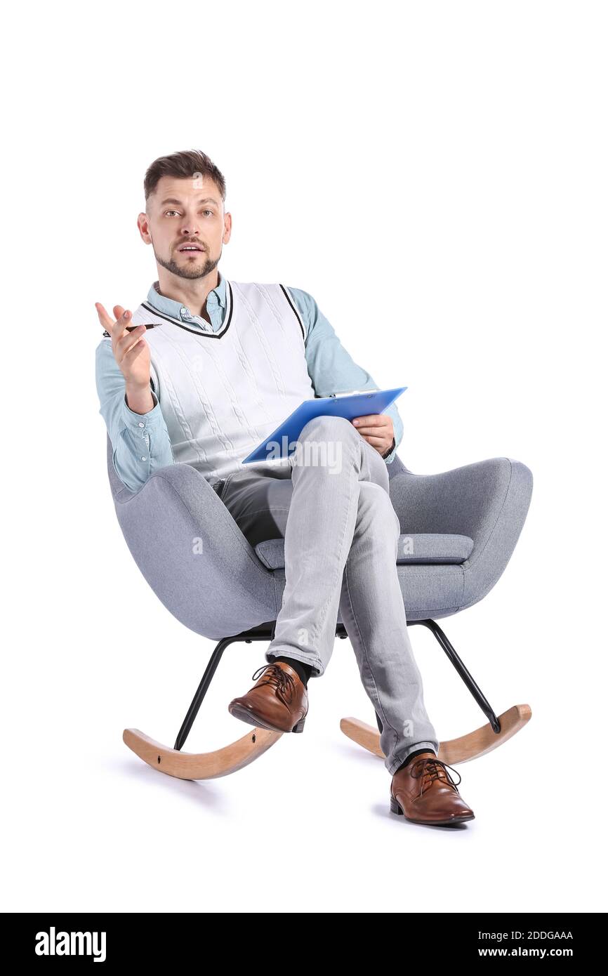 Male psychologist sitting in armchair on white background Stock Photo