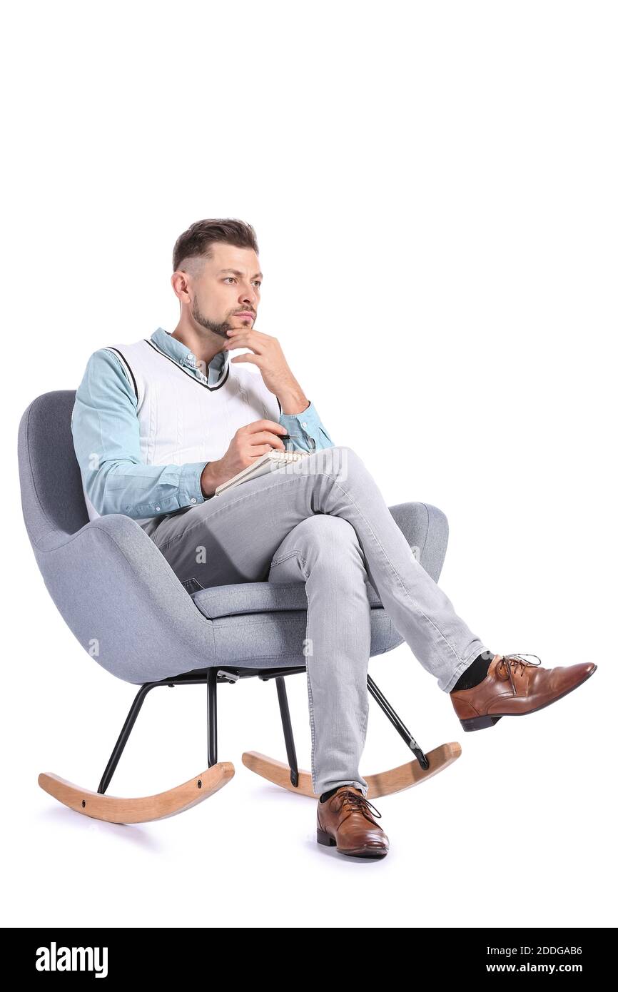 Male psychologist sitting in armchair on white background Stock Photo