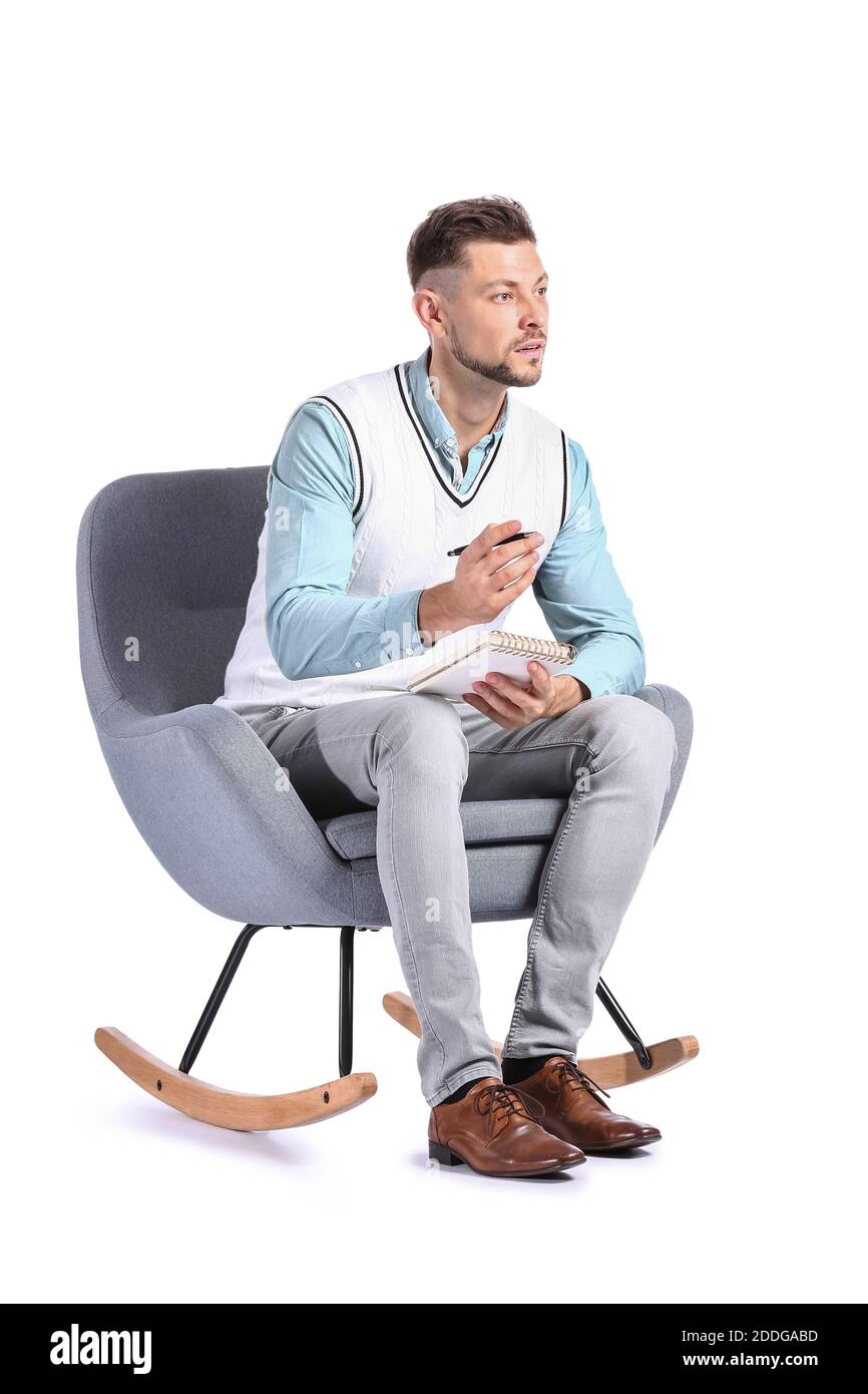 Male psychologist sitting in armchair on white background Stock Photo