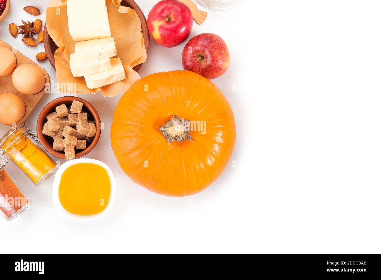 Ingredients for preparing pumpkin pie on white background Stock Photo
