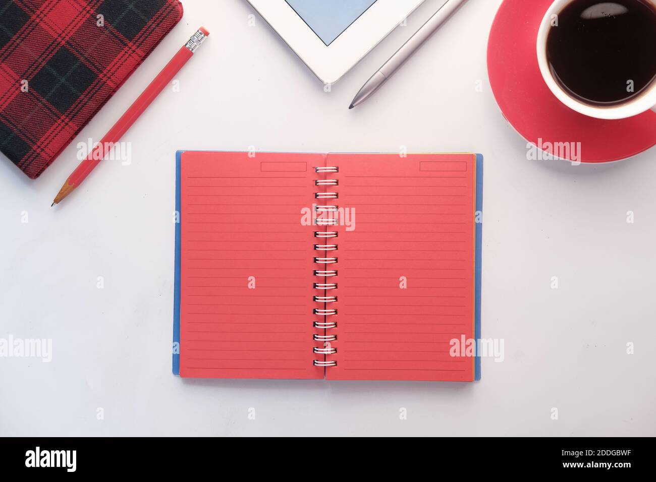 open notepad with stationary on white background  Stock Photo