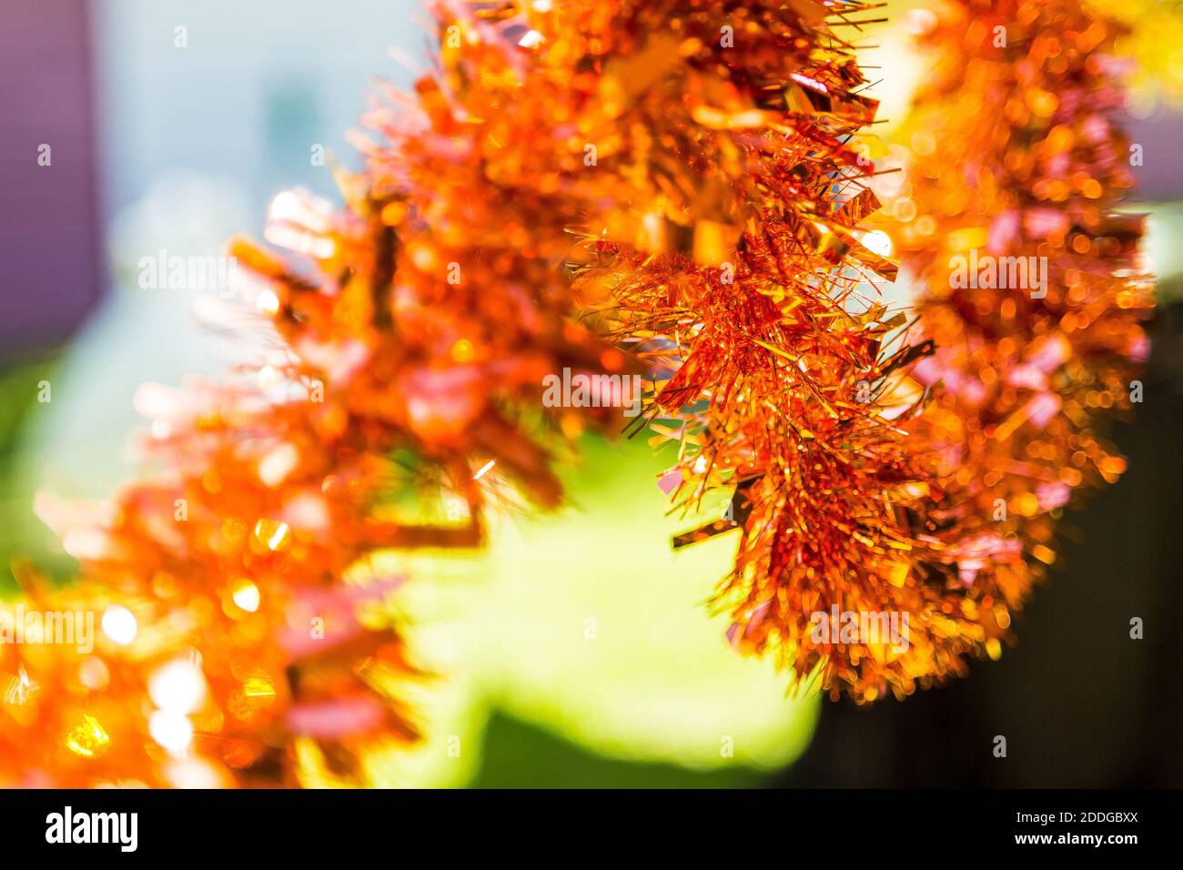 Selective focus shot of bright tinsels, hanging for Christmas decorations Stock Photo