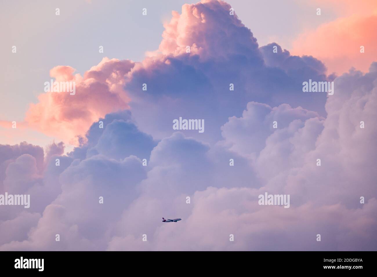 Airplane flying in dark clouds hi-res stock photography and images - Alamy