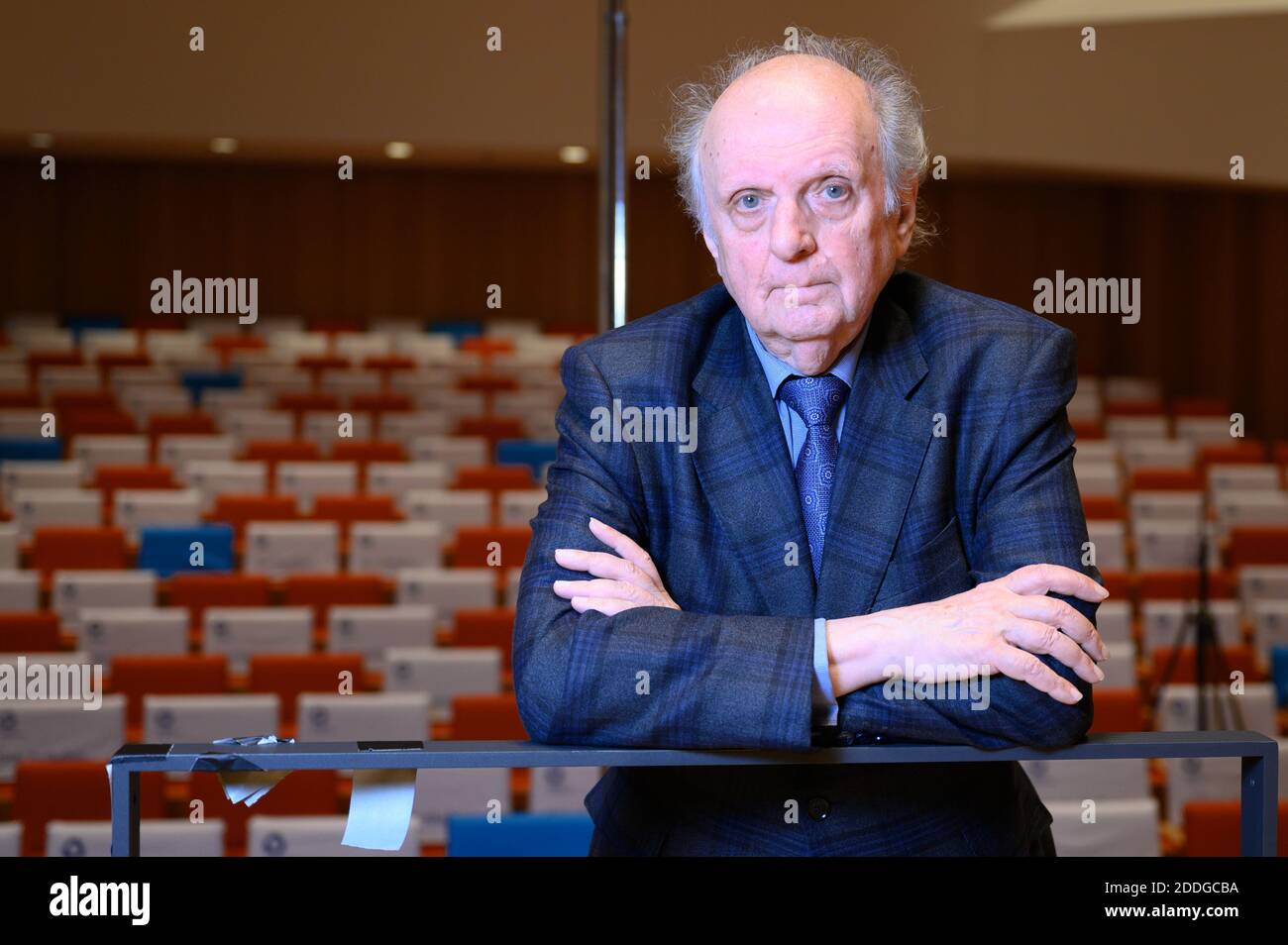Dresden, Germany. 25th Nov, 2020. Marek Janowski, conductor of the Dresden Philharmonic, is sitting on the stage in front of the empty auditorium on the fringes of a press conference in the Kulturpalast. Janowski fears severe cuts for culture even after the Corona crisis has abated. Credit: Sebastian Kahnert/dpa-Zentralbild/dpa/Alamy Live News Stock Photo