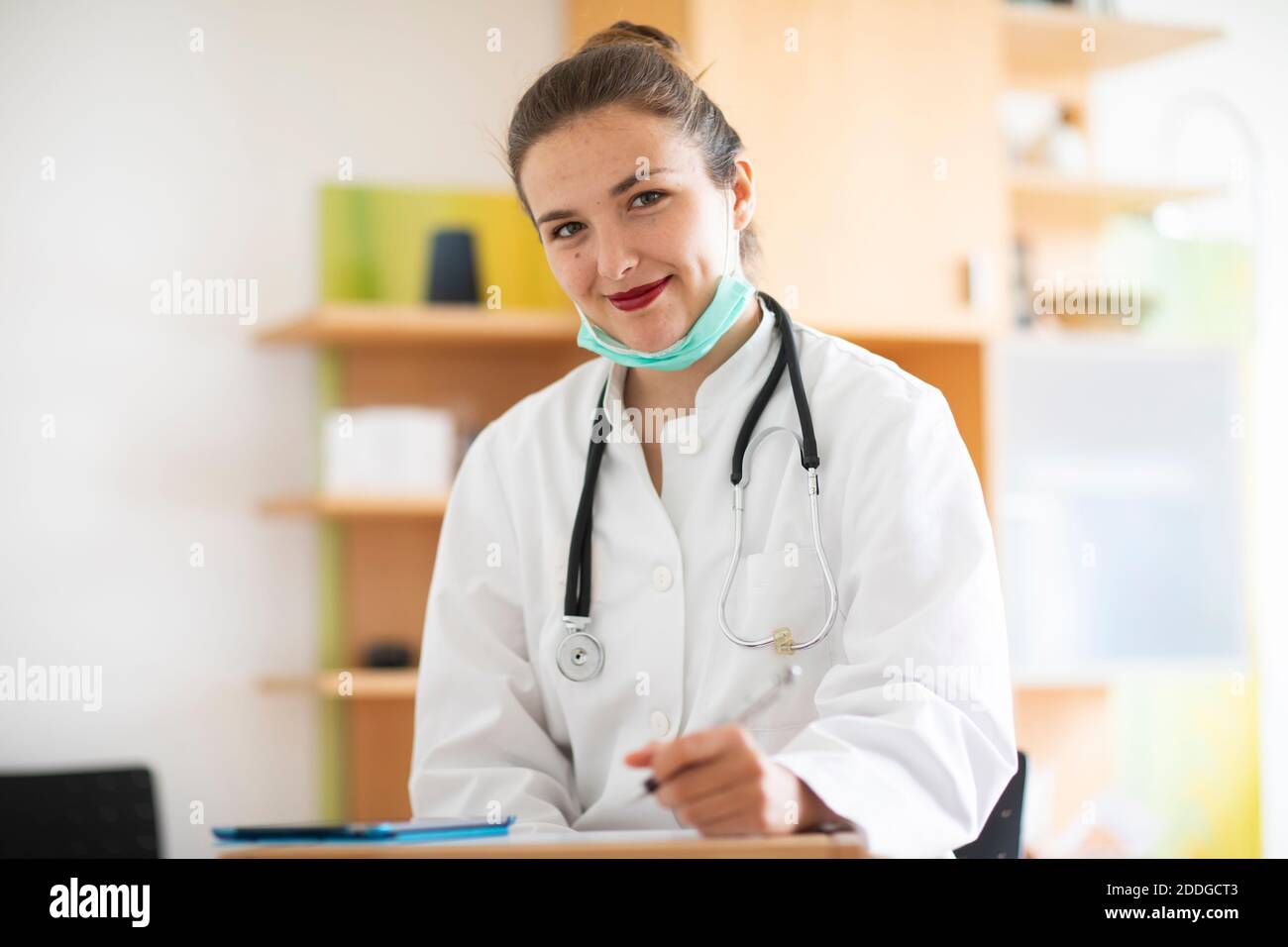 Doctor making notes Stock Photo
