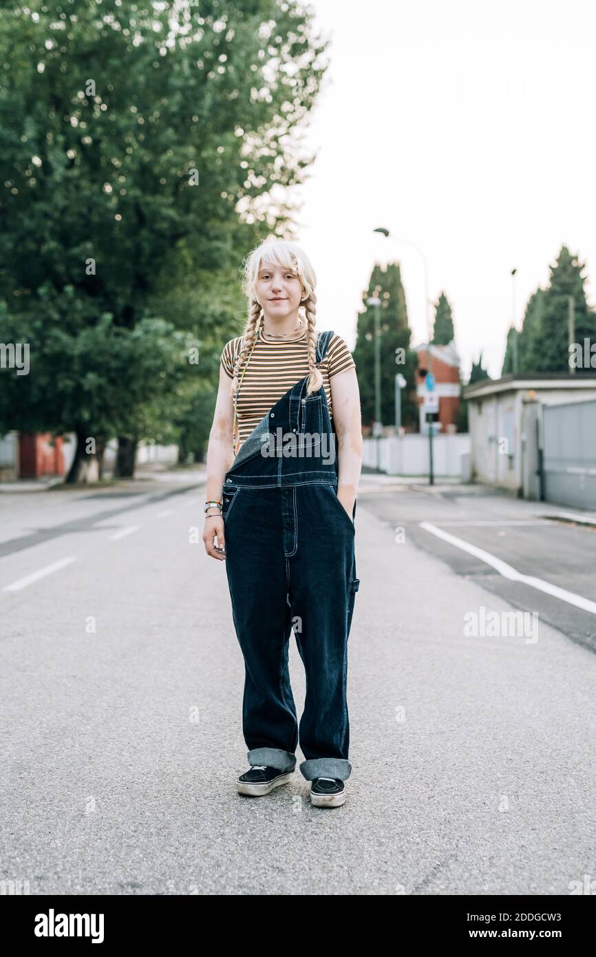 Woman standing in street hi-res stock photography and images - Alamy