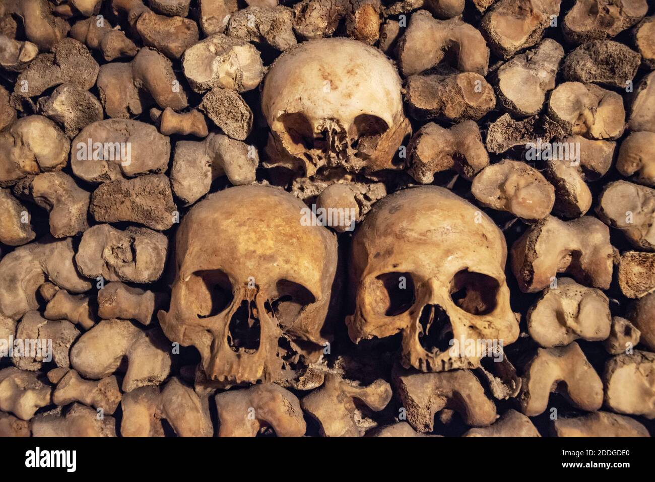 Stack of skulls and bones in the catacombs of Paris, France Stock Photo