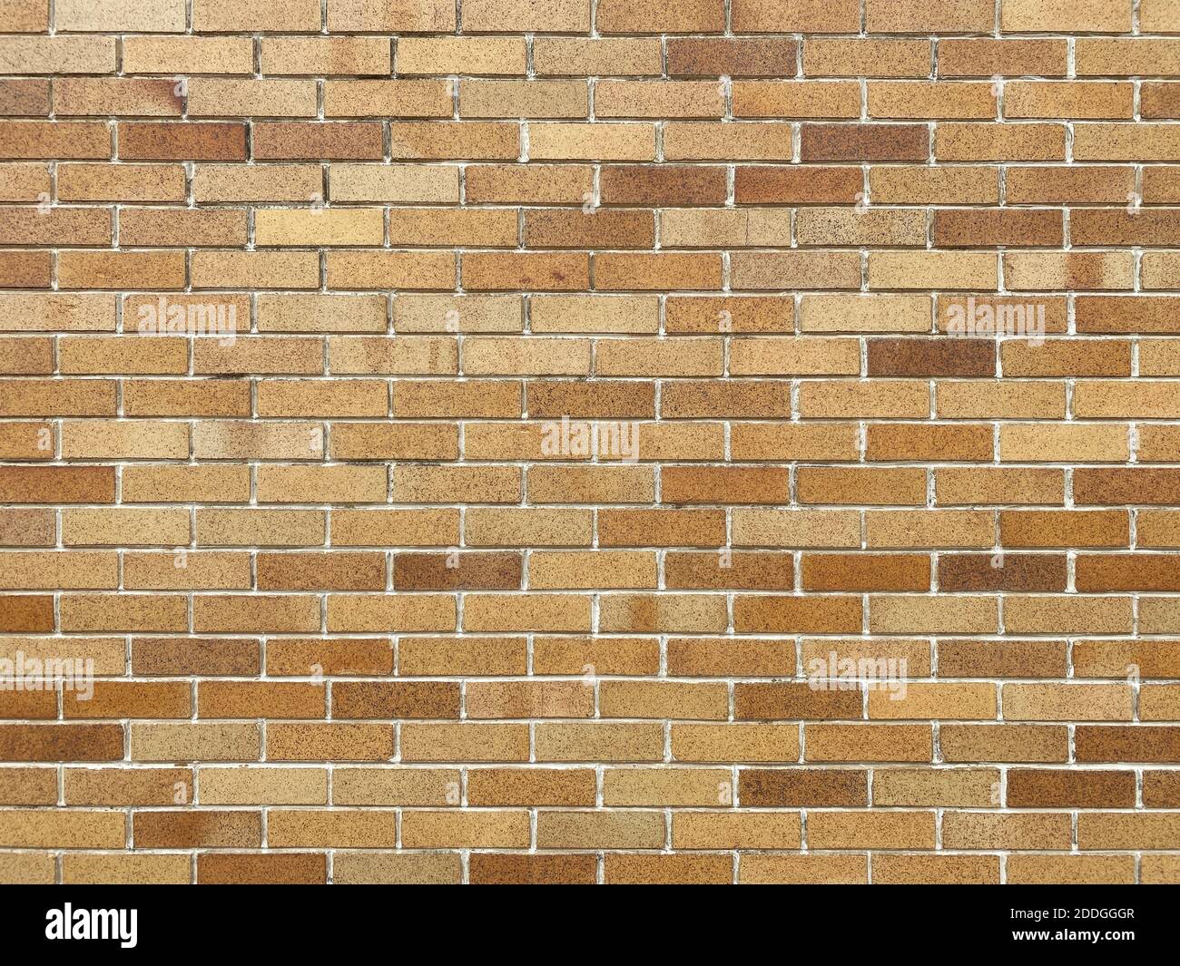 brown tan modern style brick wall wide view with deep shadows and details as backdrop background for website architecture presentation scenery Stock Photo