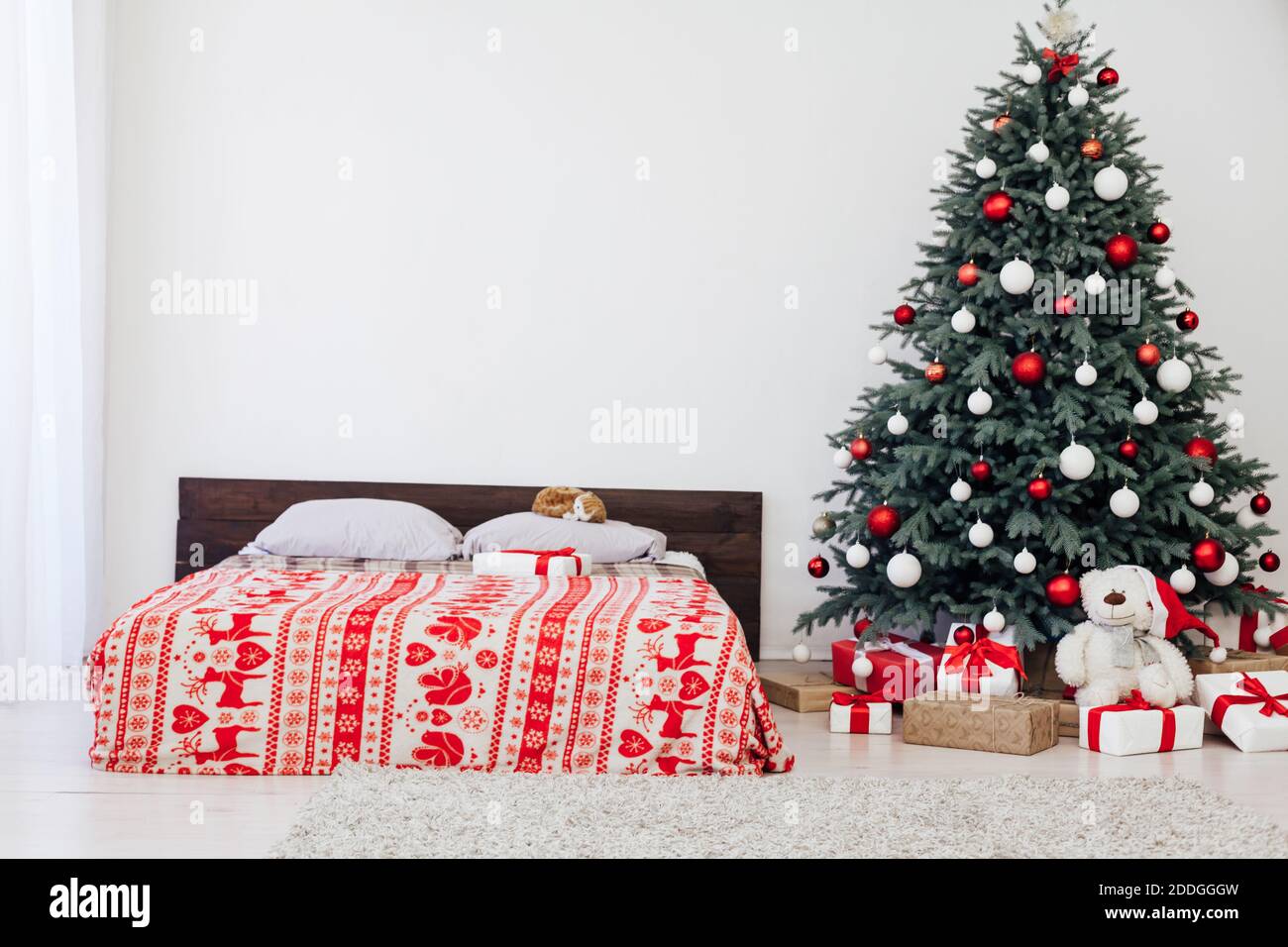 New year bedroom decor with Christmas tree bed with gifts and garlands