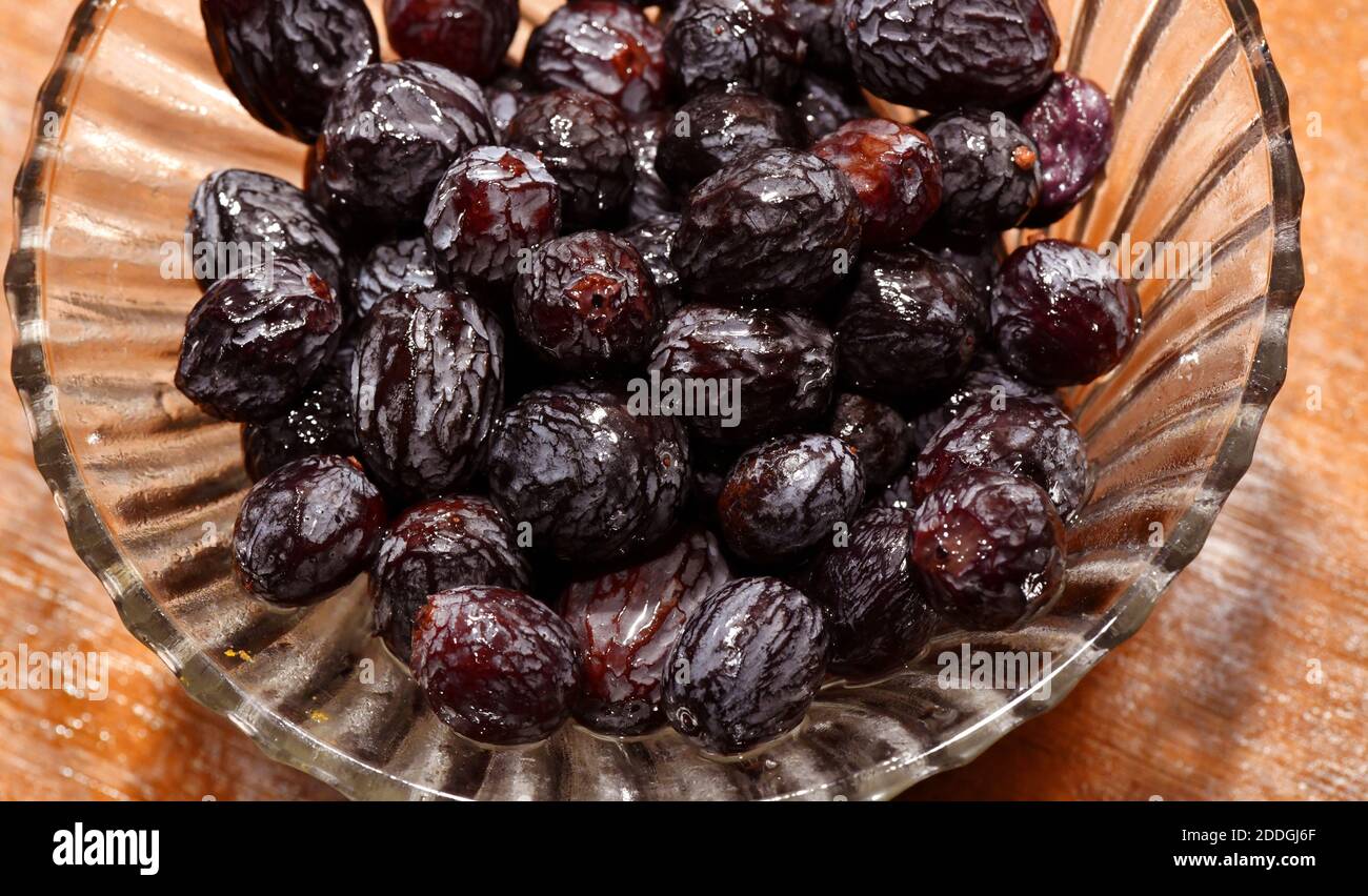 Soaked black raisins hires stock photography and images Alamy