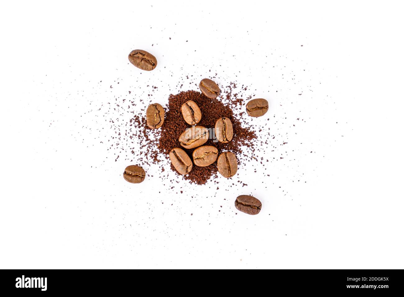 Roasted coffee beans with ground coffee on white background Stock Photo