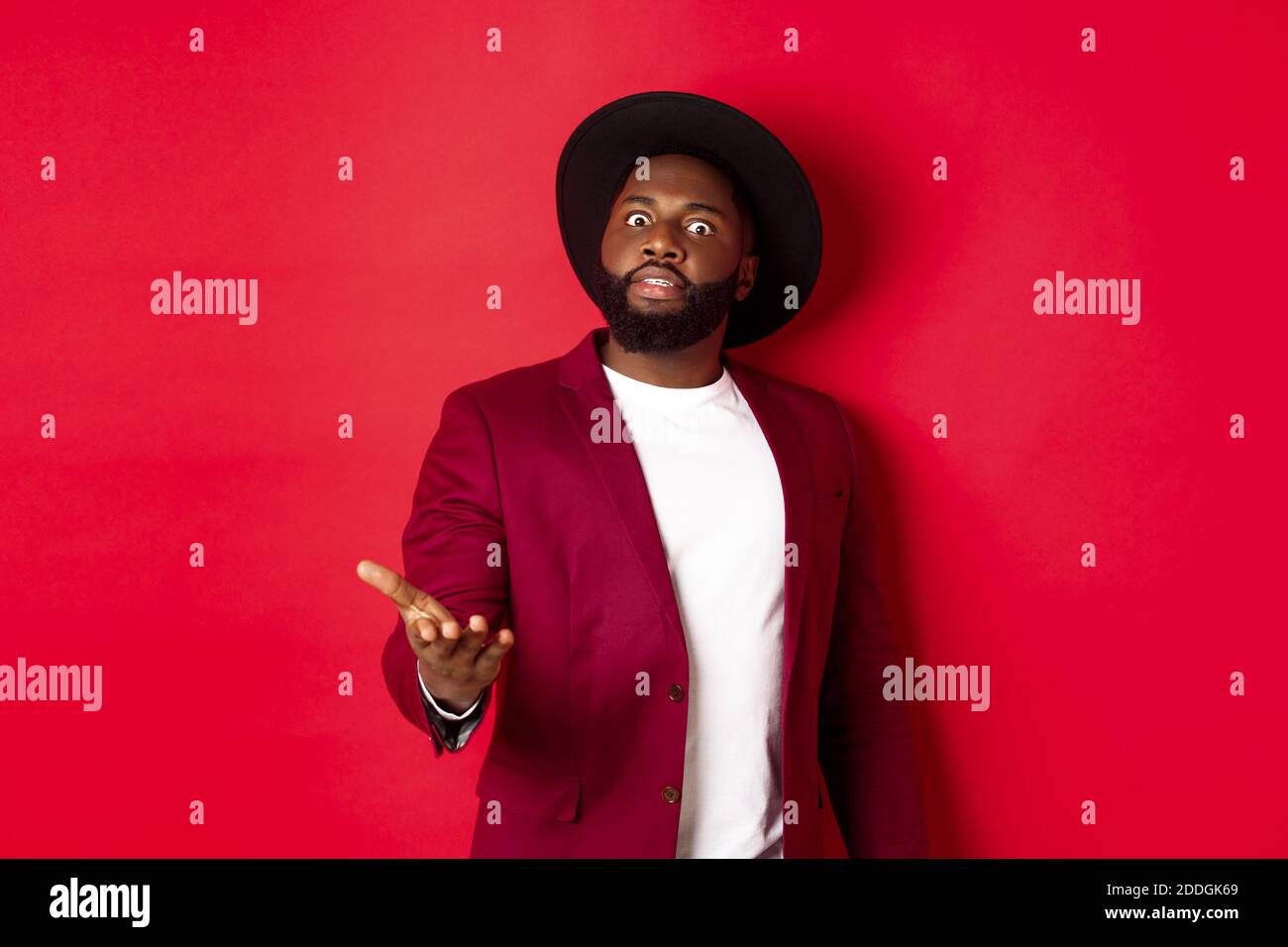 Shocked african american man staring at camera and pointing at ...