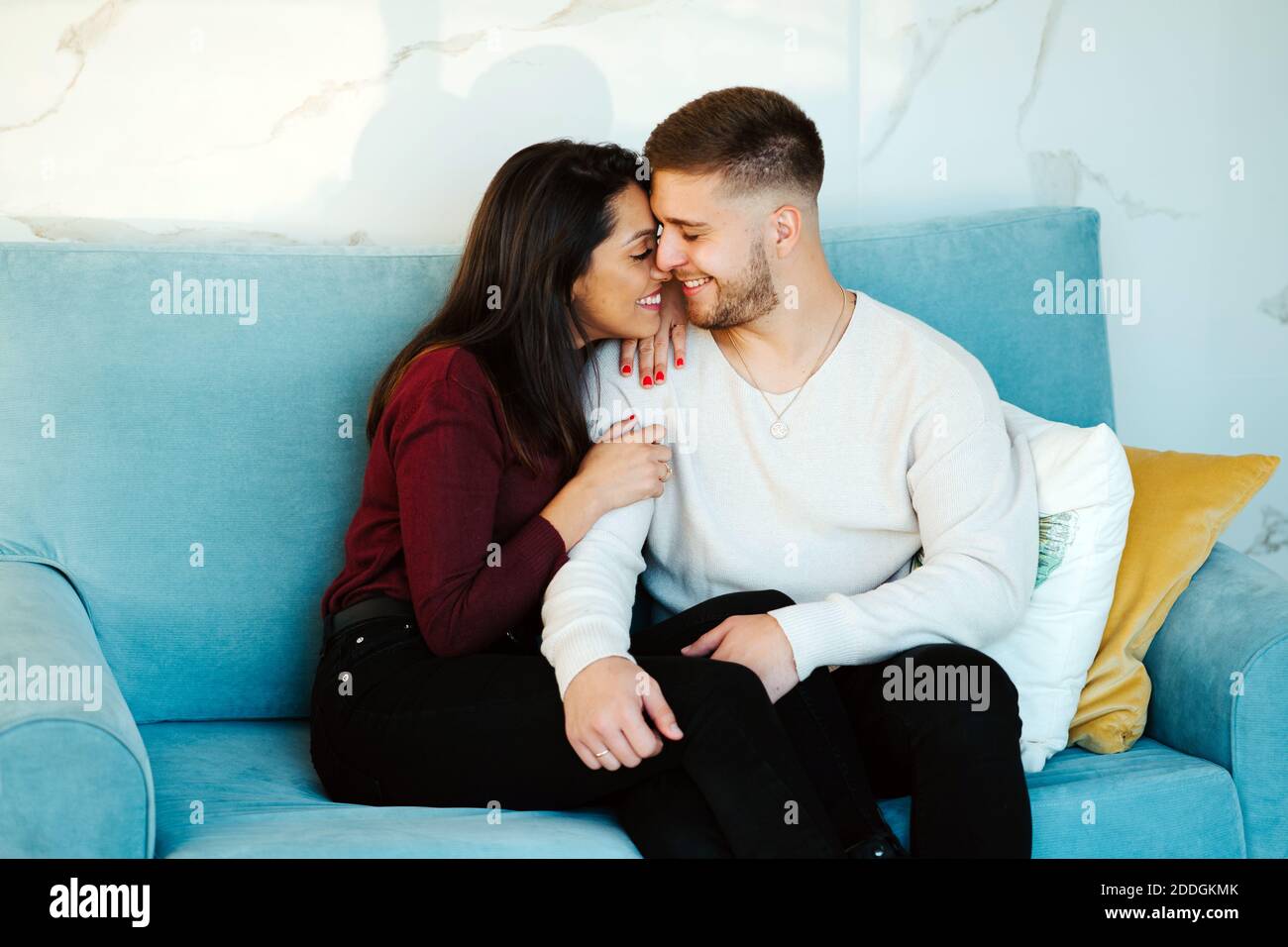Couple cuddle sofa hi res stock photography and images Page 4