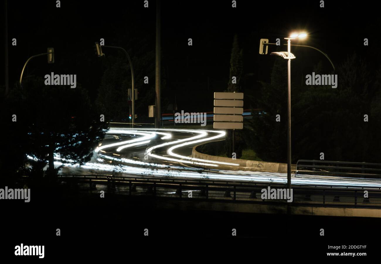 The light trails of traffic on the road at night Stock Photo - Alamy