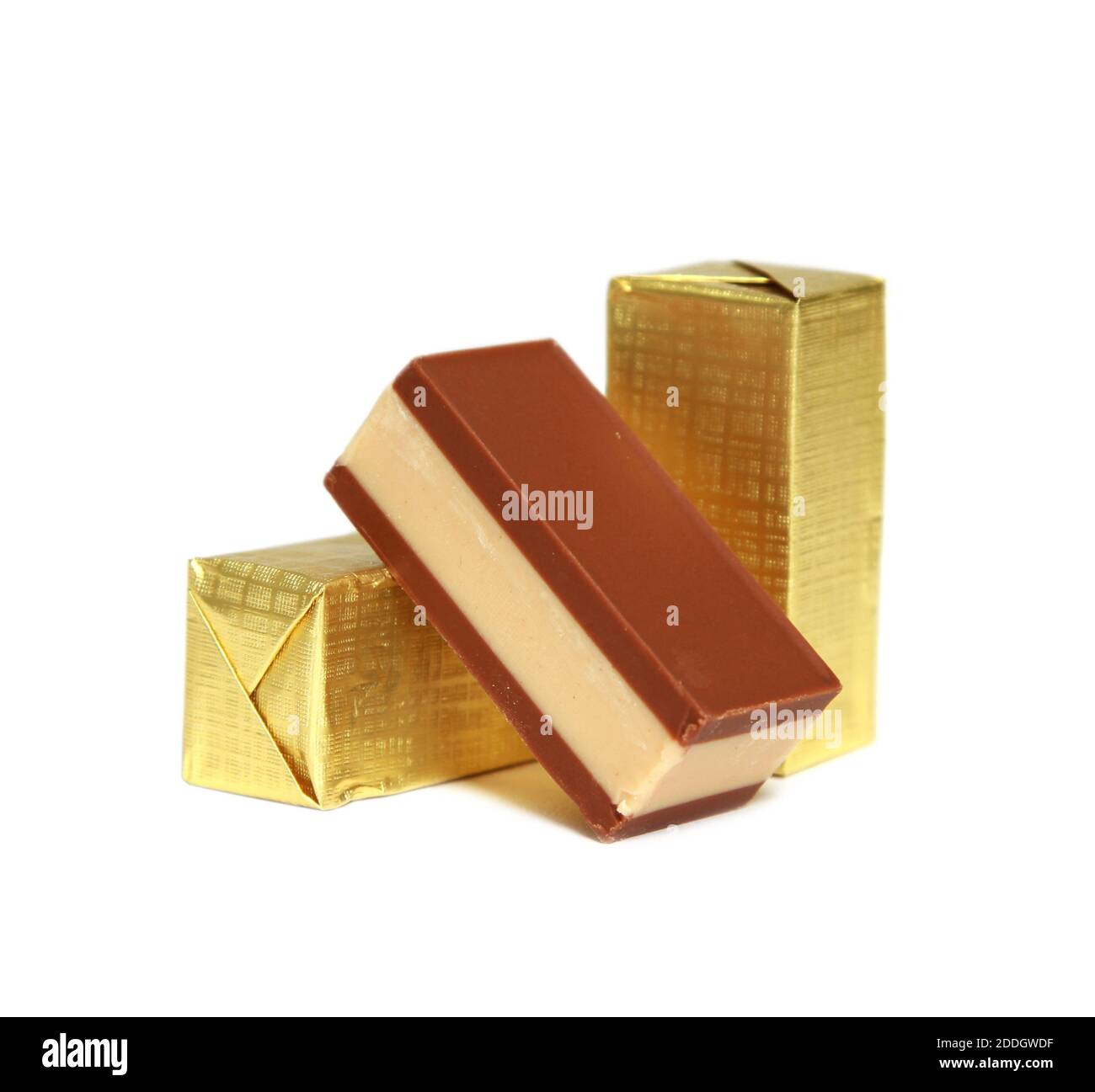 Chocolate candies in gold wrapping on a white background Stock Photo Alamy