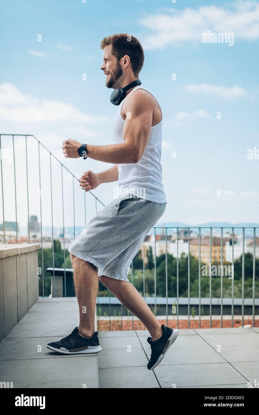 Outdoor health and fitness workout on a rooftop terrace Stock Photo