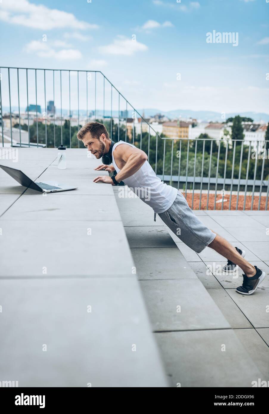 Outdoor health and fitness workout on a rooftop terrace Stock Photo