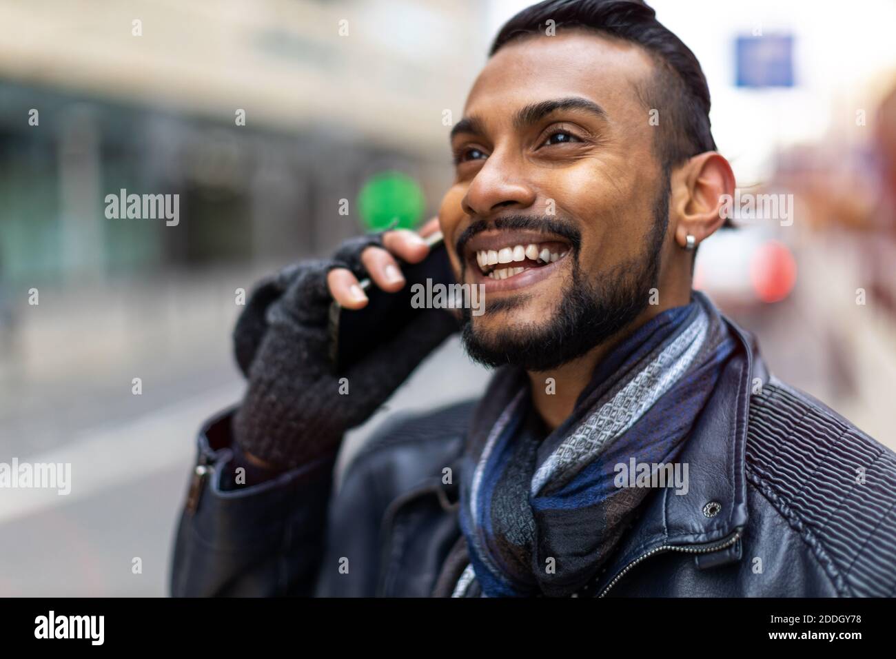 Handsome young man using mobile phone at the street Stock Photo