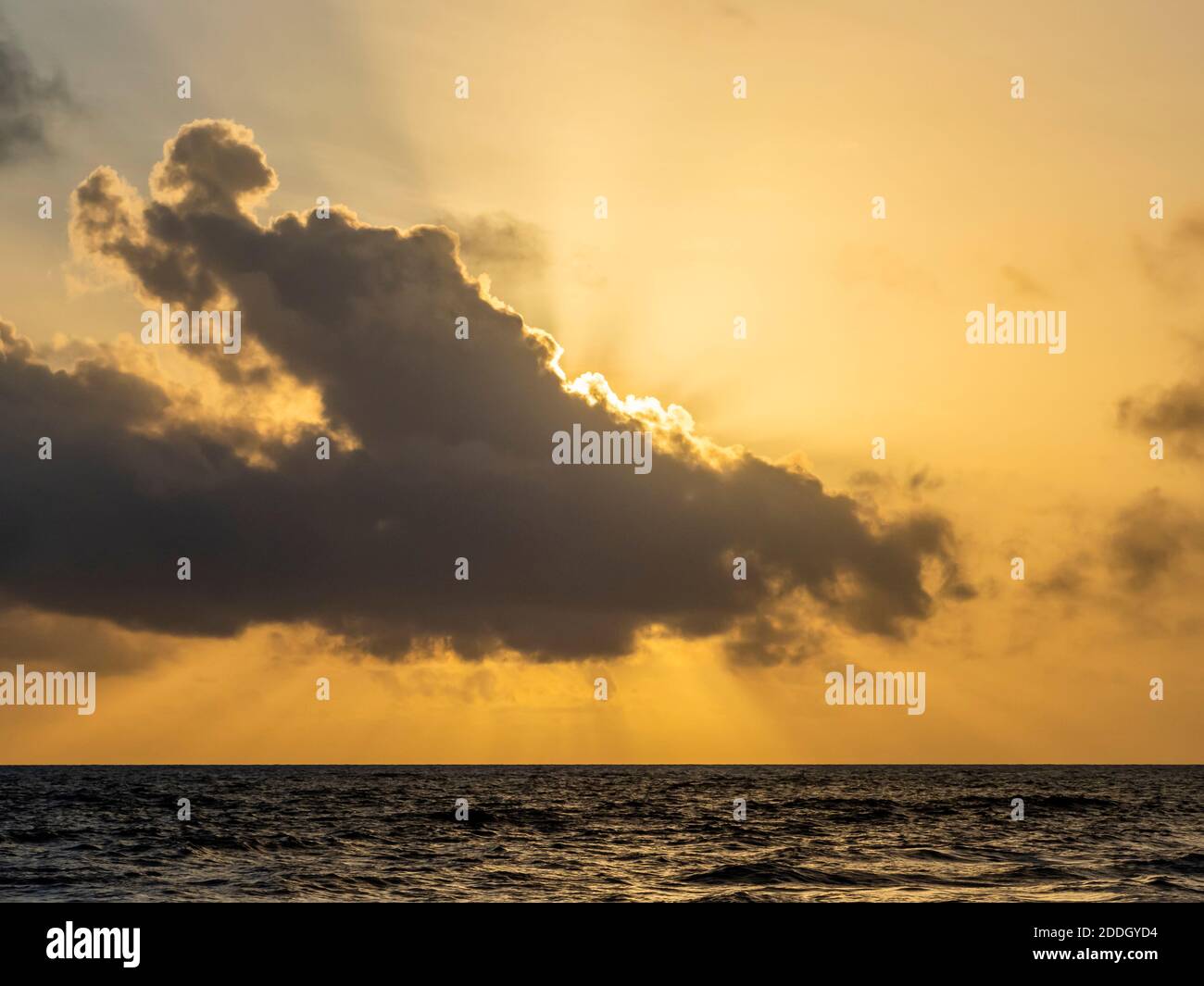 God rays from sun behind clouds oiver the Gulf of Mexico from Sanibel Island Florida in the United States Stock Photo