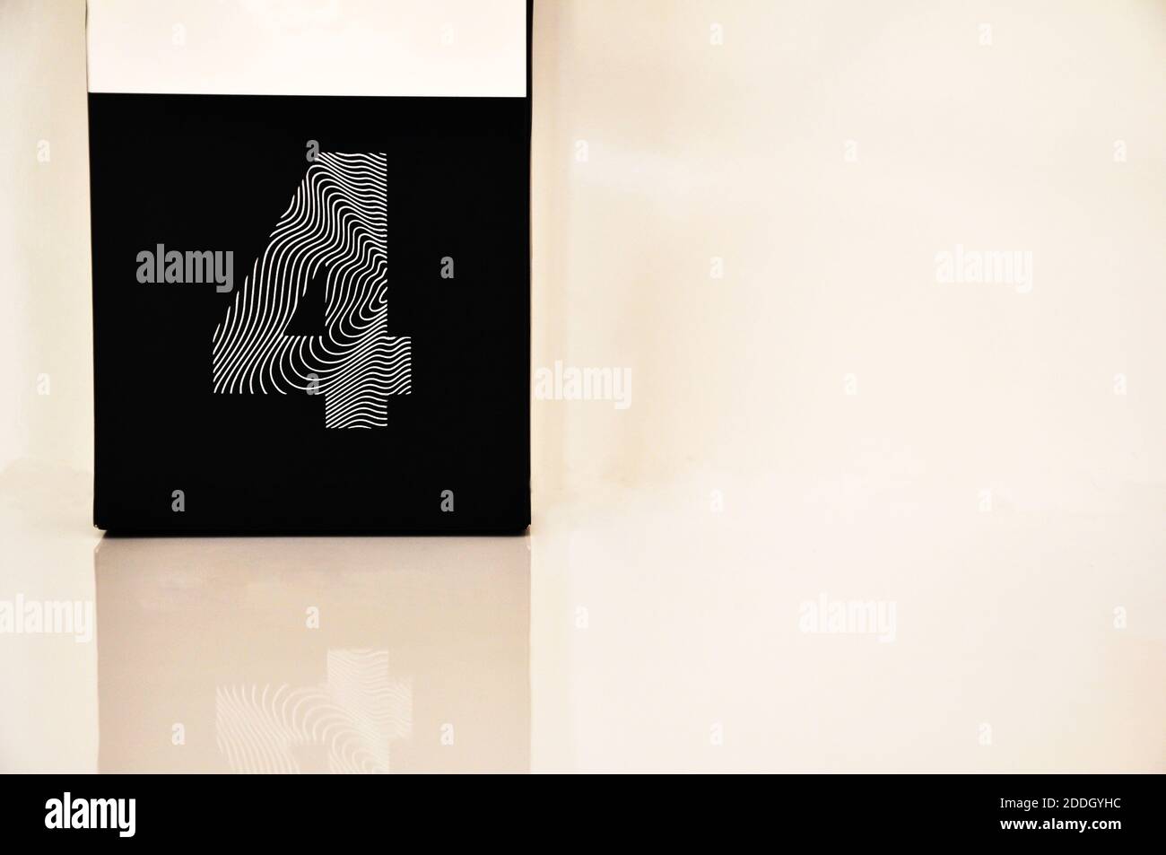 Number four. white cardboard, with black background and number four in white, with white background and copy space, Brazil, South America Stock Photo