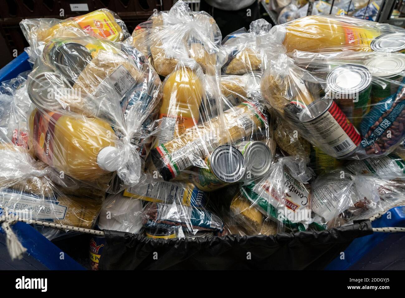 Bags with turkeys prepared for distribution to needy families with National Guards and Governor Cuomo at NY Common Pantry. Many people because of pandemic lost their jobs, income and slipped behind on rent, they started to rely on many pantries around the state to receive free groceries and produce. That is American tradition to have turkey for dinner on Thanksgiving Day holiday and Governor Cuomo helped organize distribution of Butterball and Shady Brook Farms turkeys. Governor as well as Common Pantry volunteers and staff and members of National Guards were wearing special facial mask “Don't Stock Photo