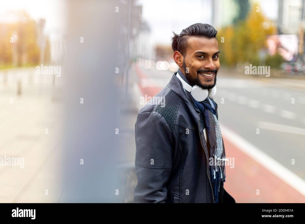 Portrait of a handsome young man on the city street Stock Photo