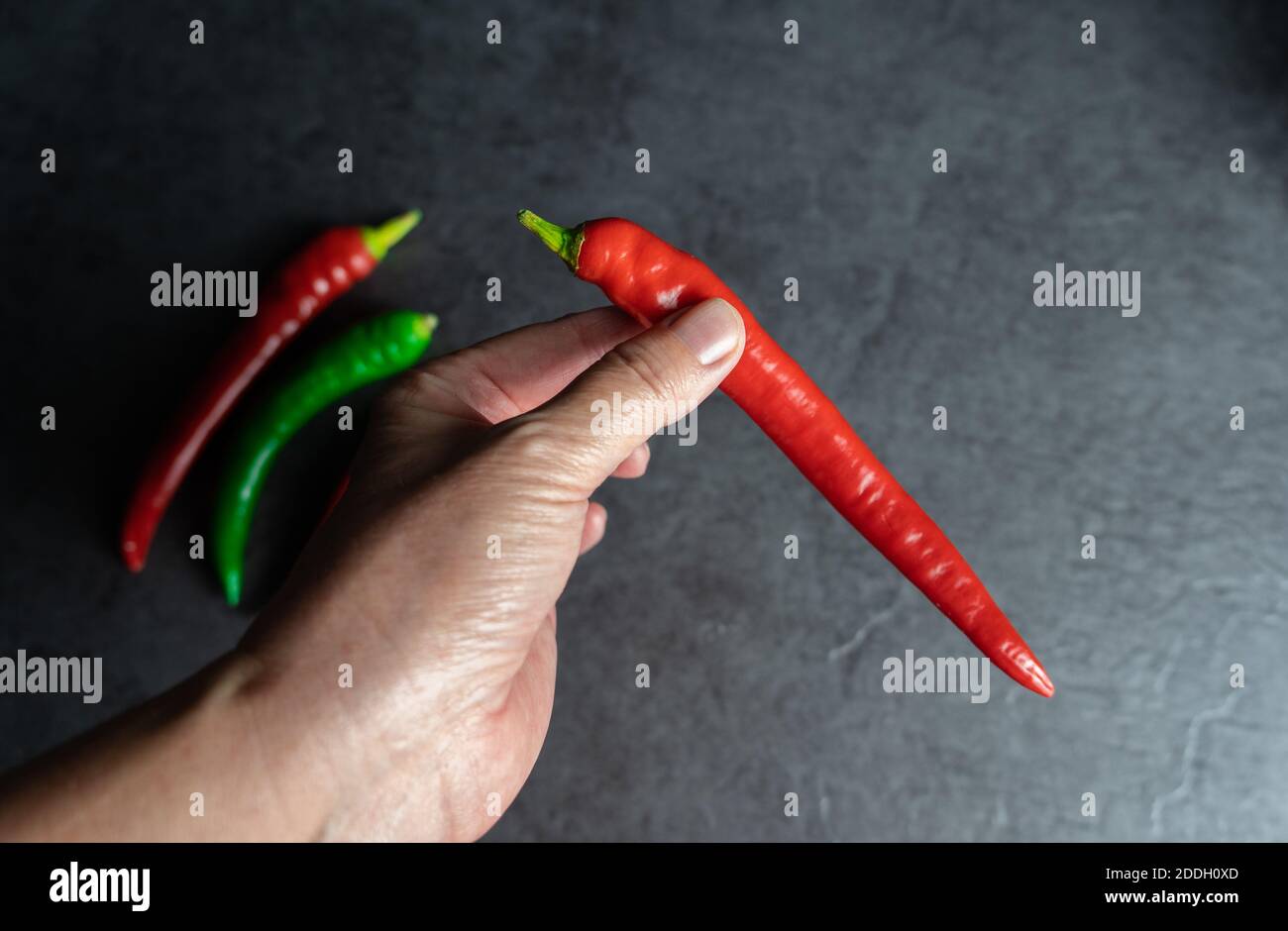 Red hot chili pepper eating woman hi-res stock photography and images ...